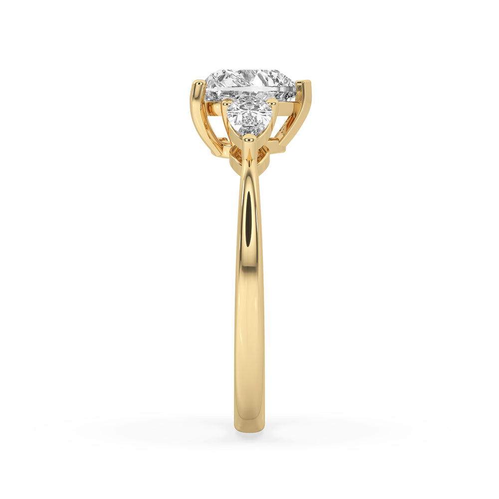 3 diamond engagement ring with a heart cut diamond ring set in a yellow gold diamond ring for timeless beauty.
