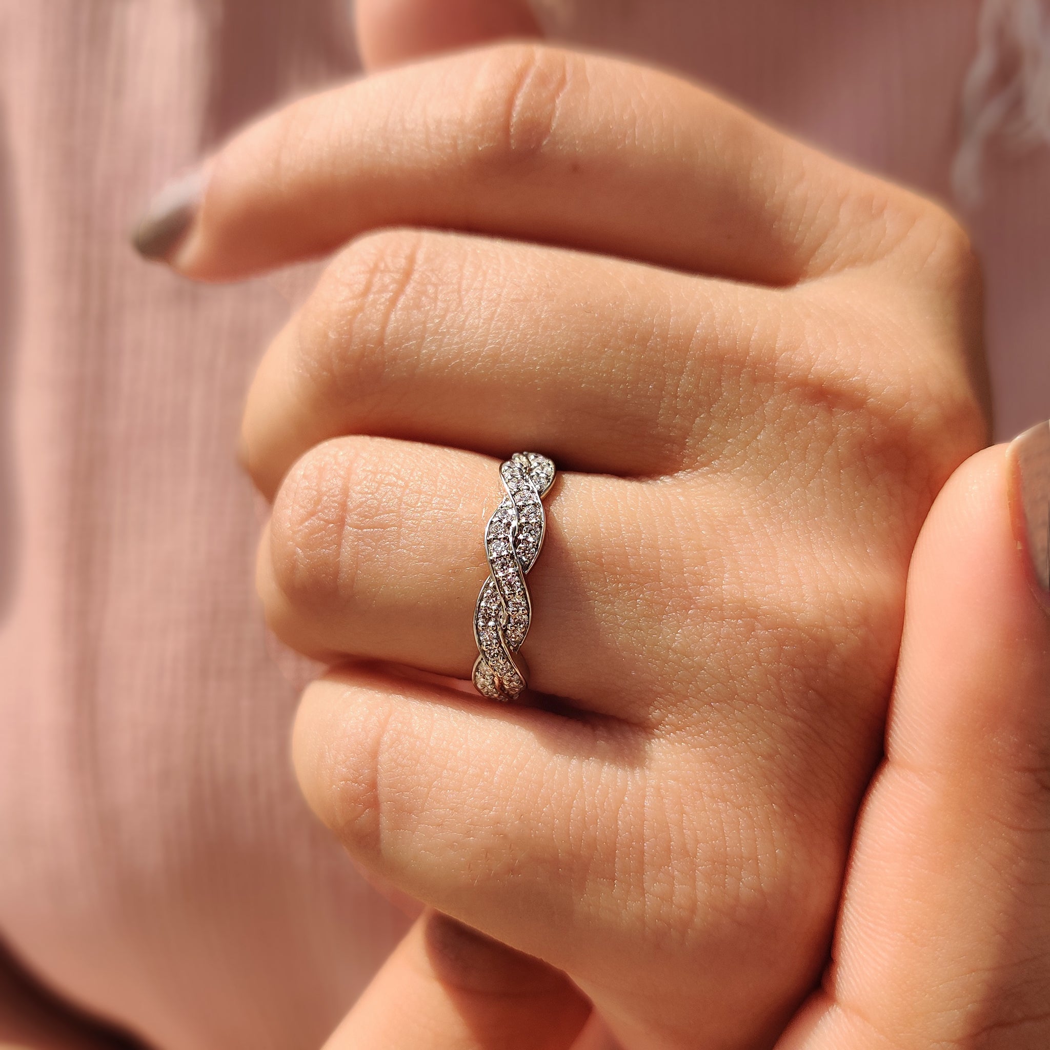 Round cut diamond set on a custom wedding band.
