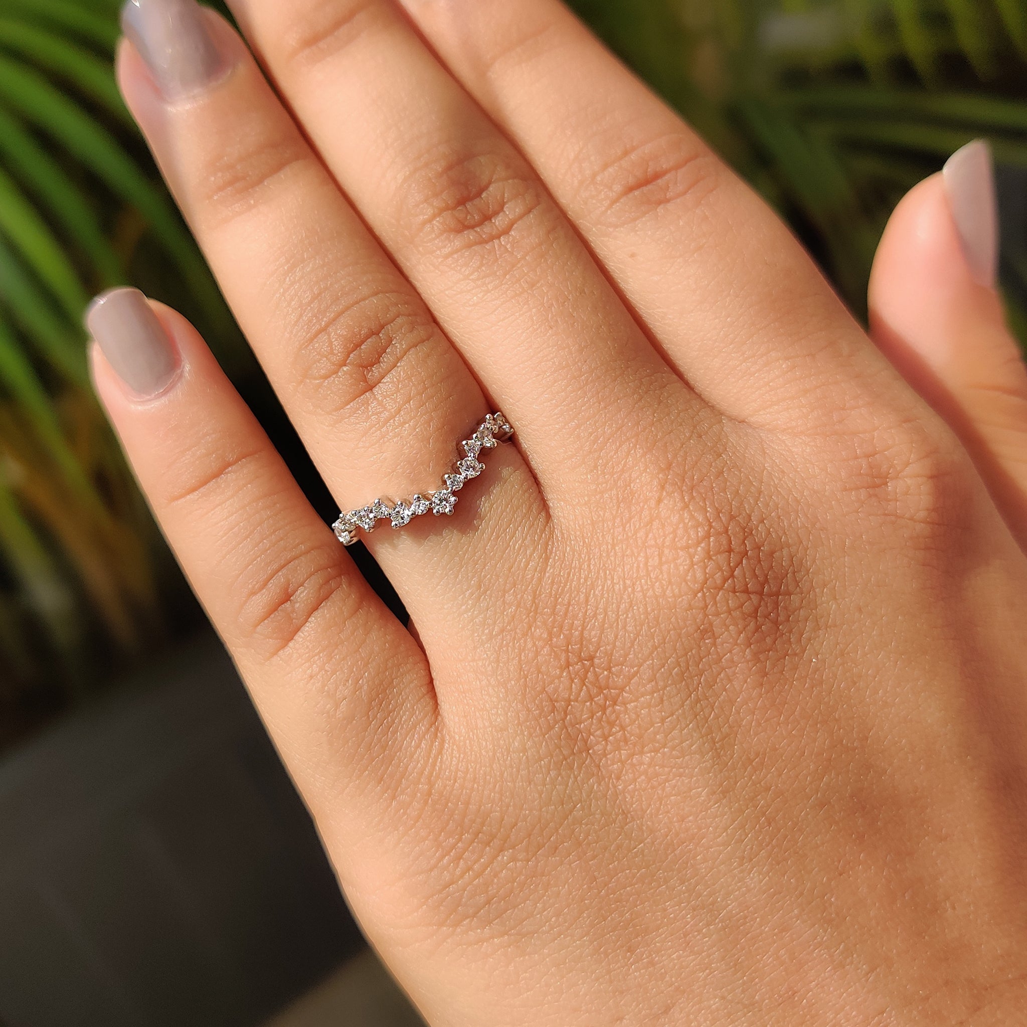 Prong set wedding band with a delicate curve for a unique fit.
