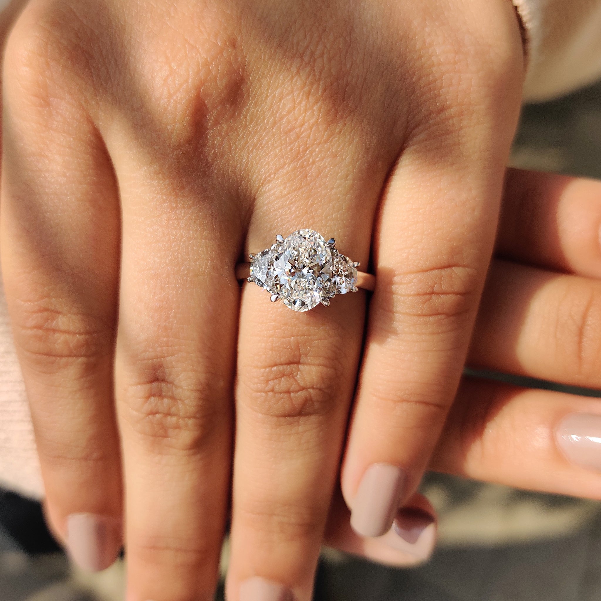 Oval Cut Diamond Engagement Ring With Half Moon Side Stone
