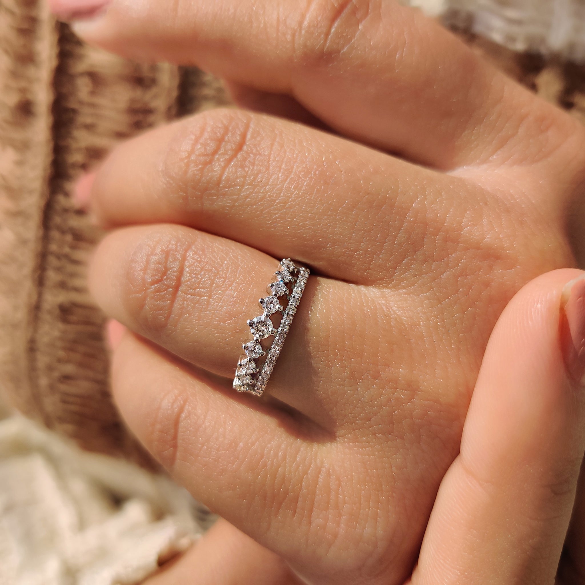 Lab grown diamond band reflecting under studio lighting.
