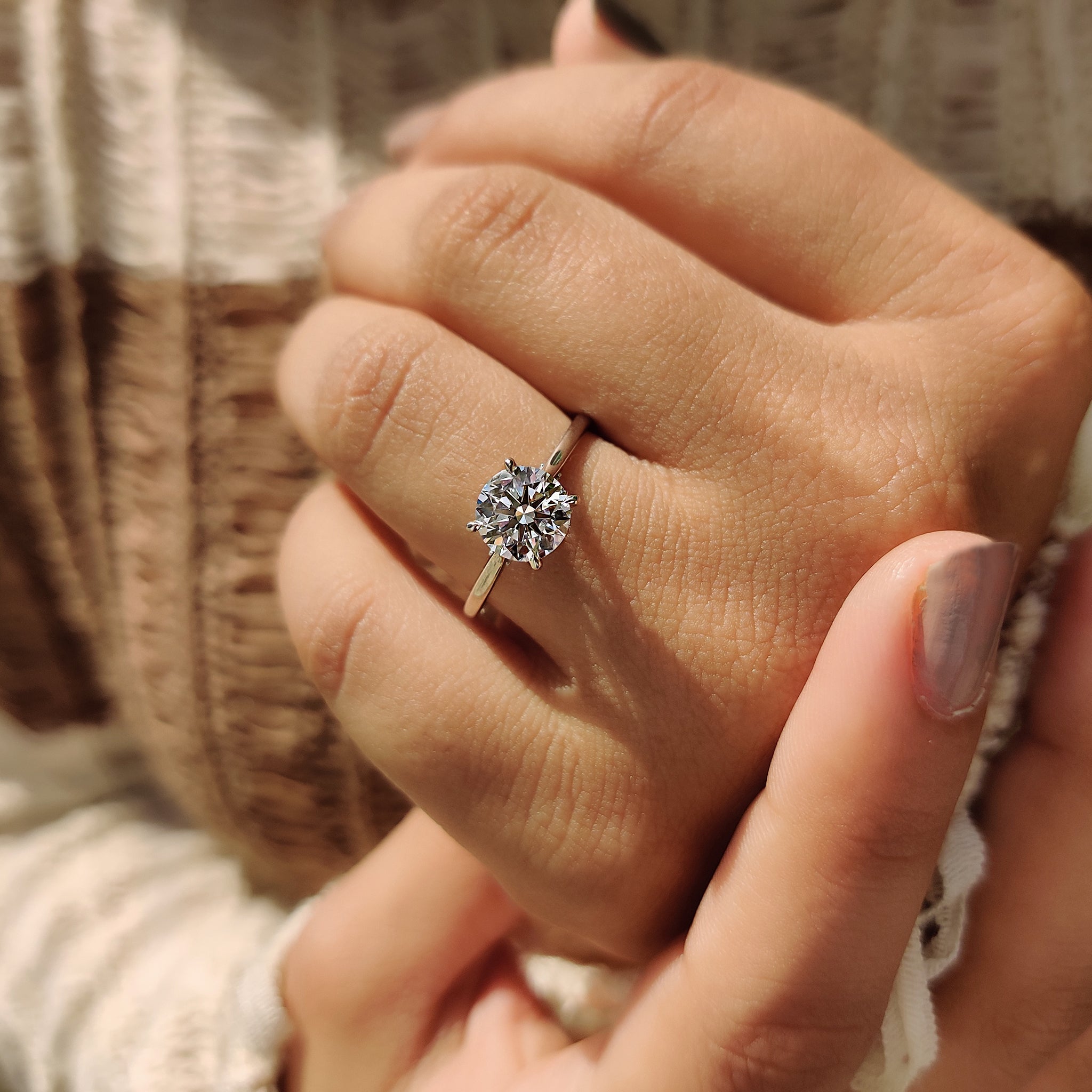 Round cut diamond ring with cathedral diamond ring.