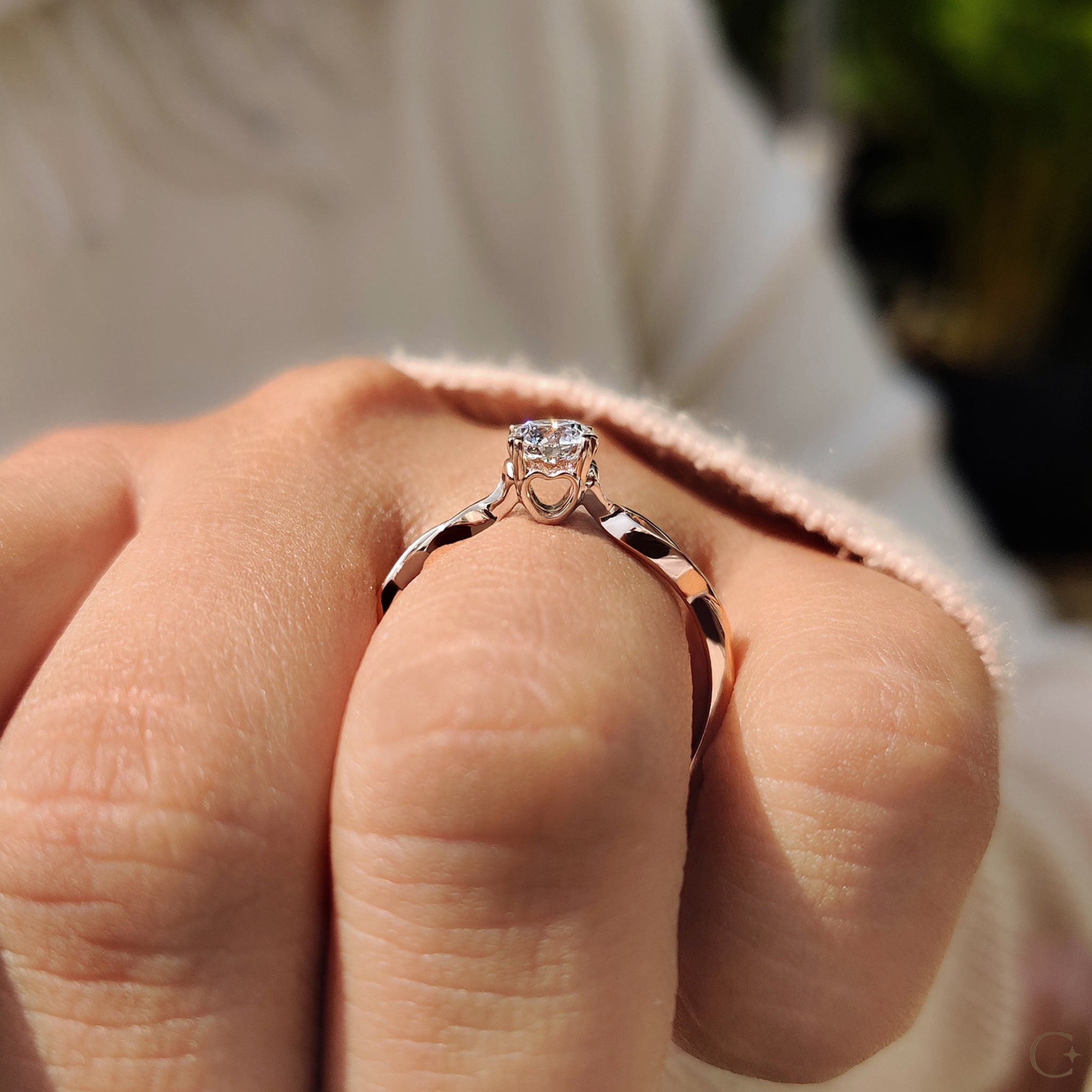 Customizable engagement ring with a twisted shank and Lab Grown Diamond.
