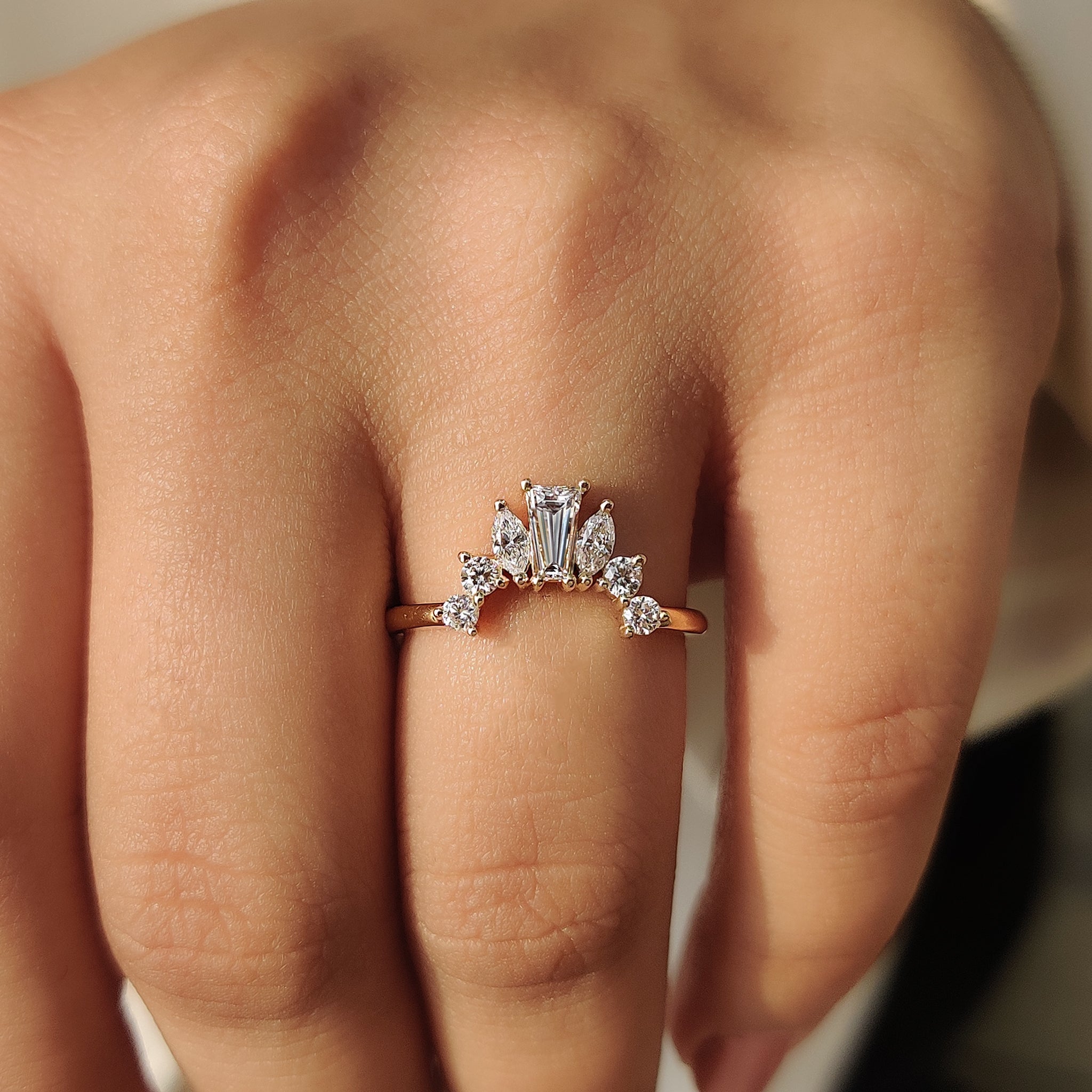 Yellow gold wedding band in tapered baguette wedding band.
