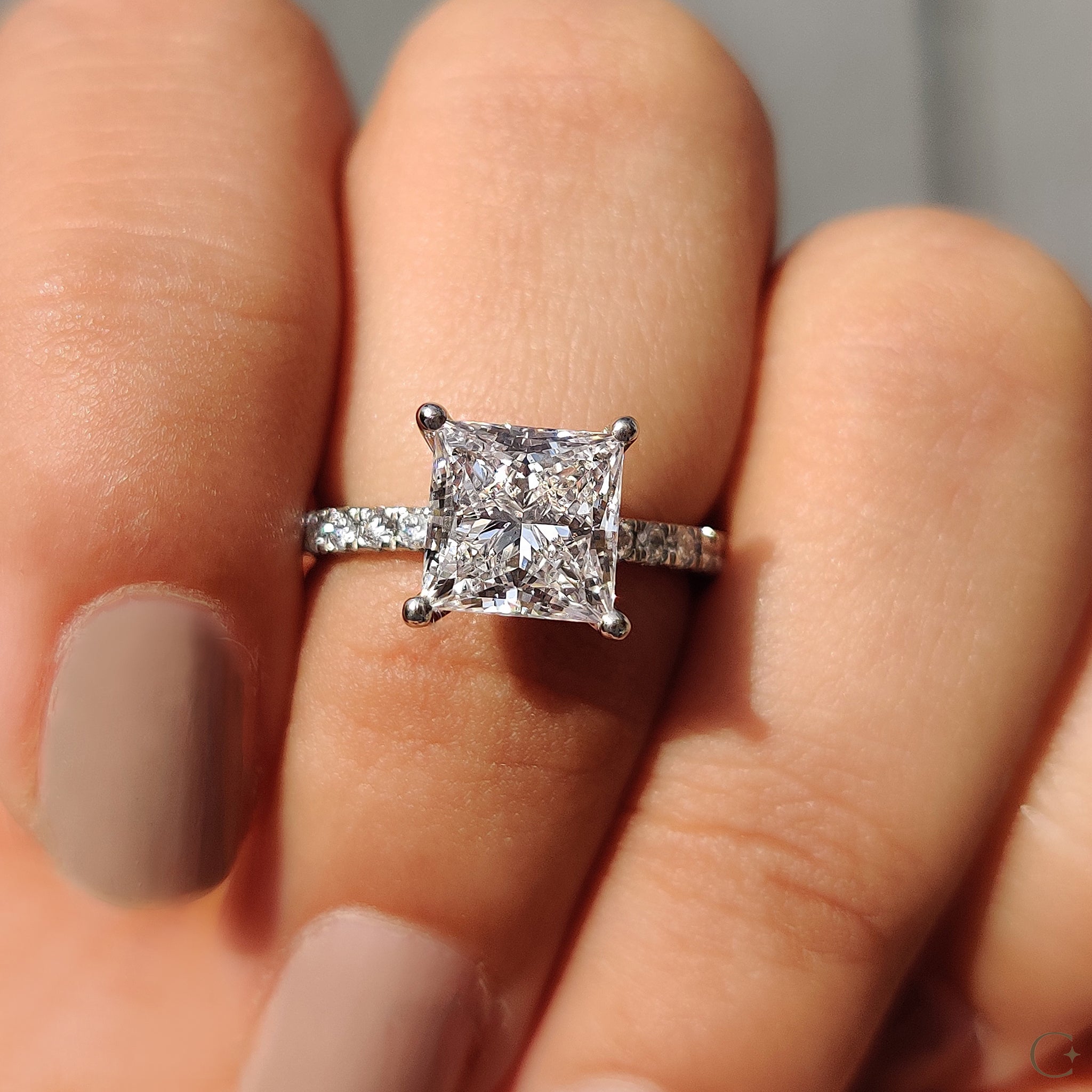 White gold diamond ring featuring intricate pave details.
