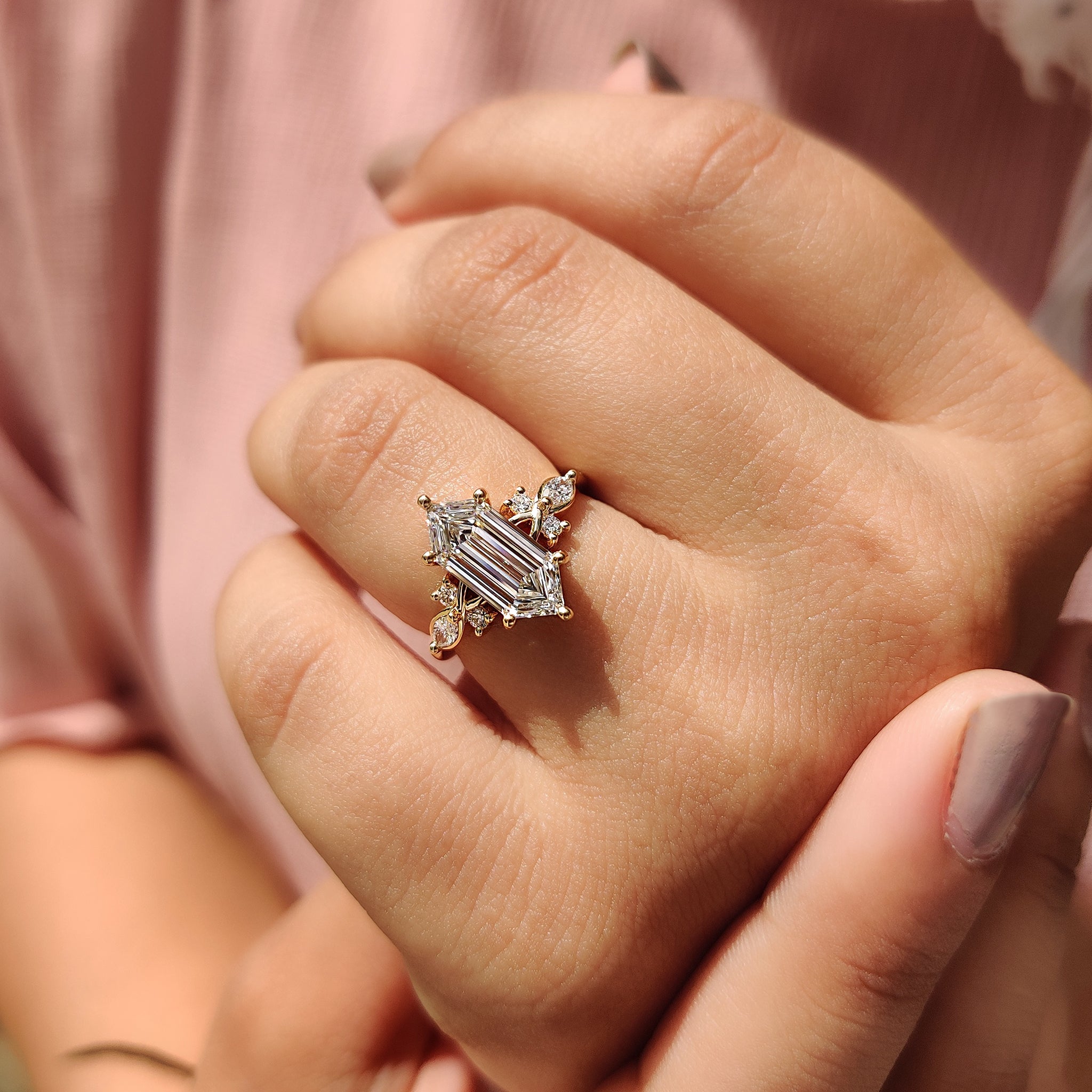 Tapered shank engagement ring with yellow gold engagement ring.