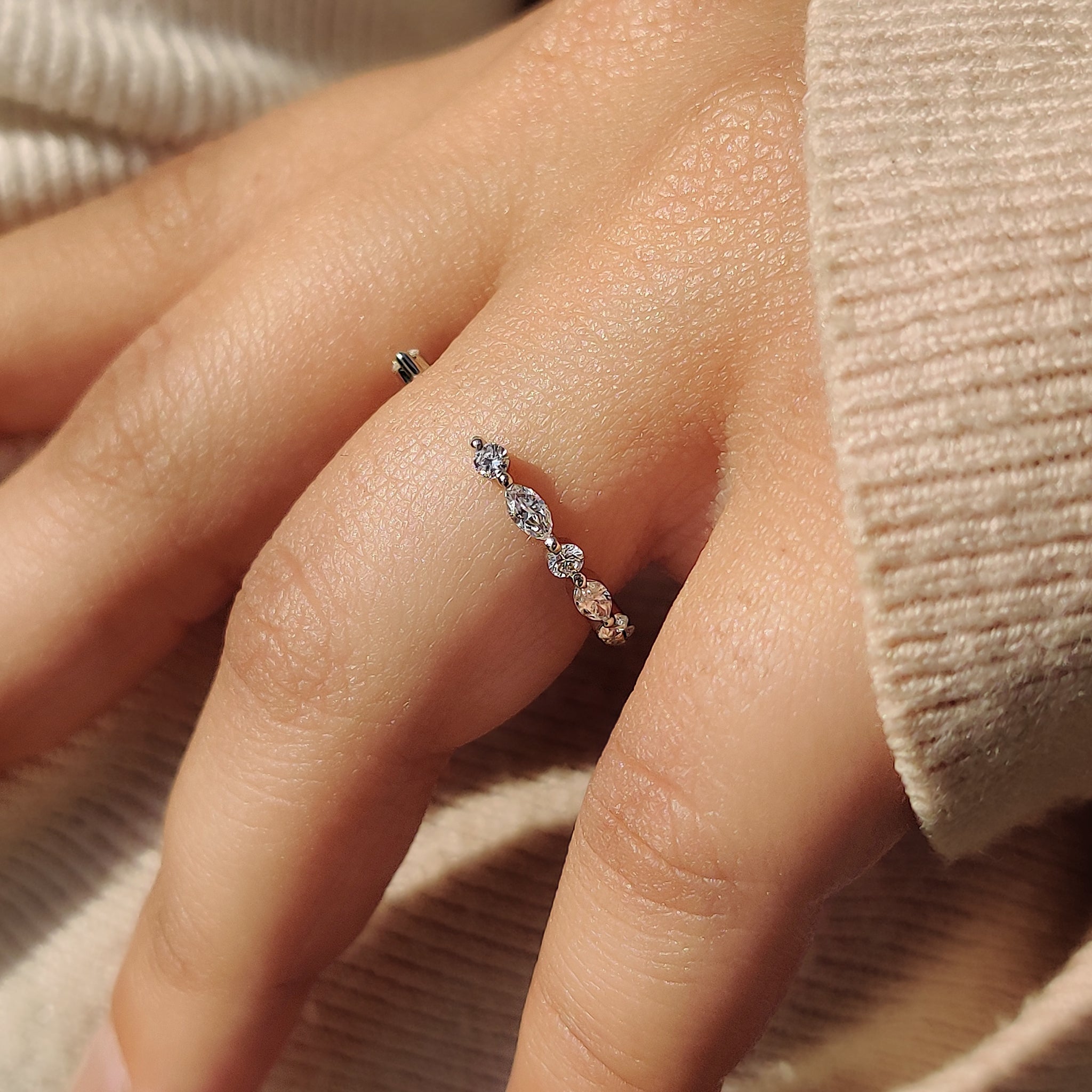 Elegant open gape wedding band with sparkling diamonds on each side.
