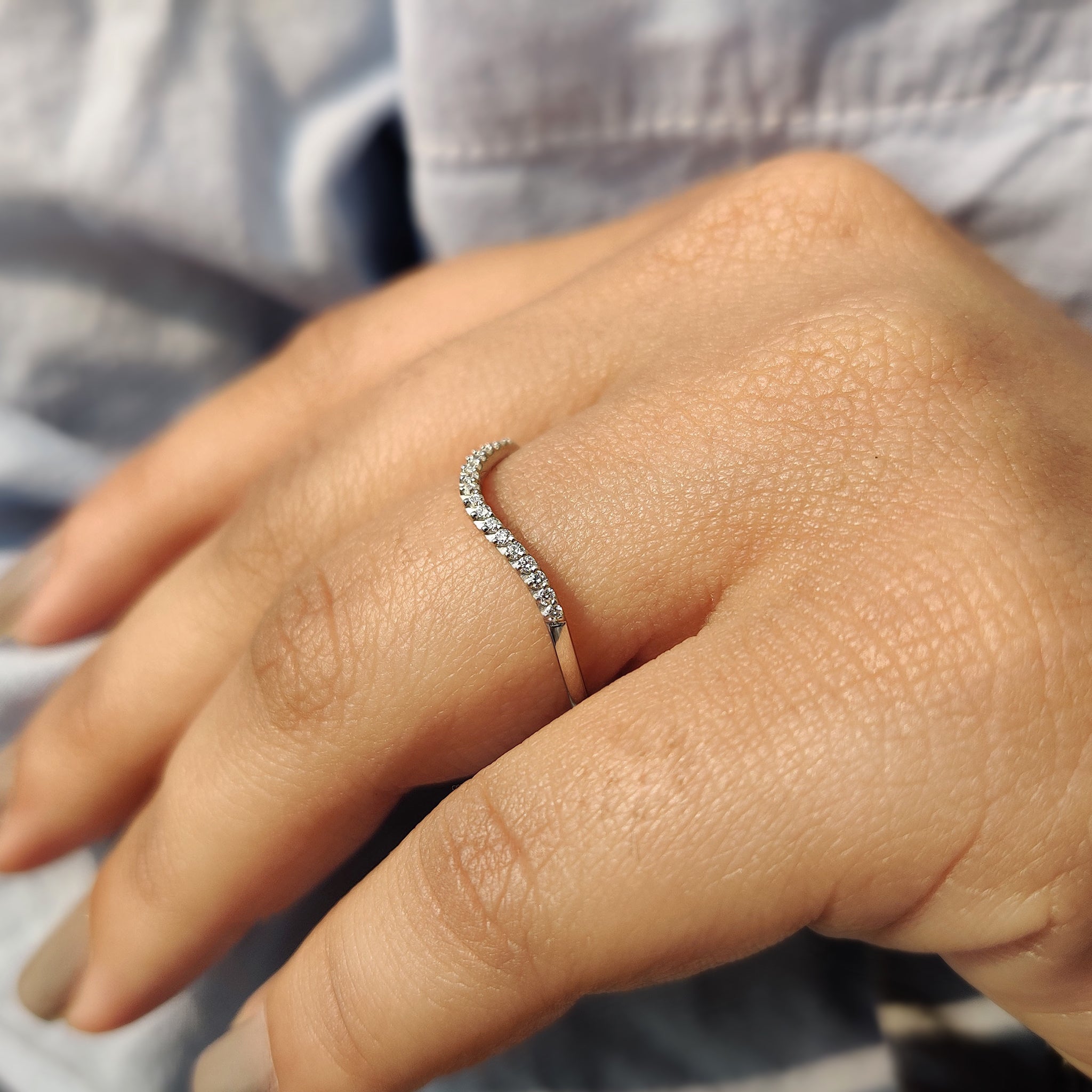 Curved wedding band in white gold.