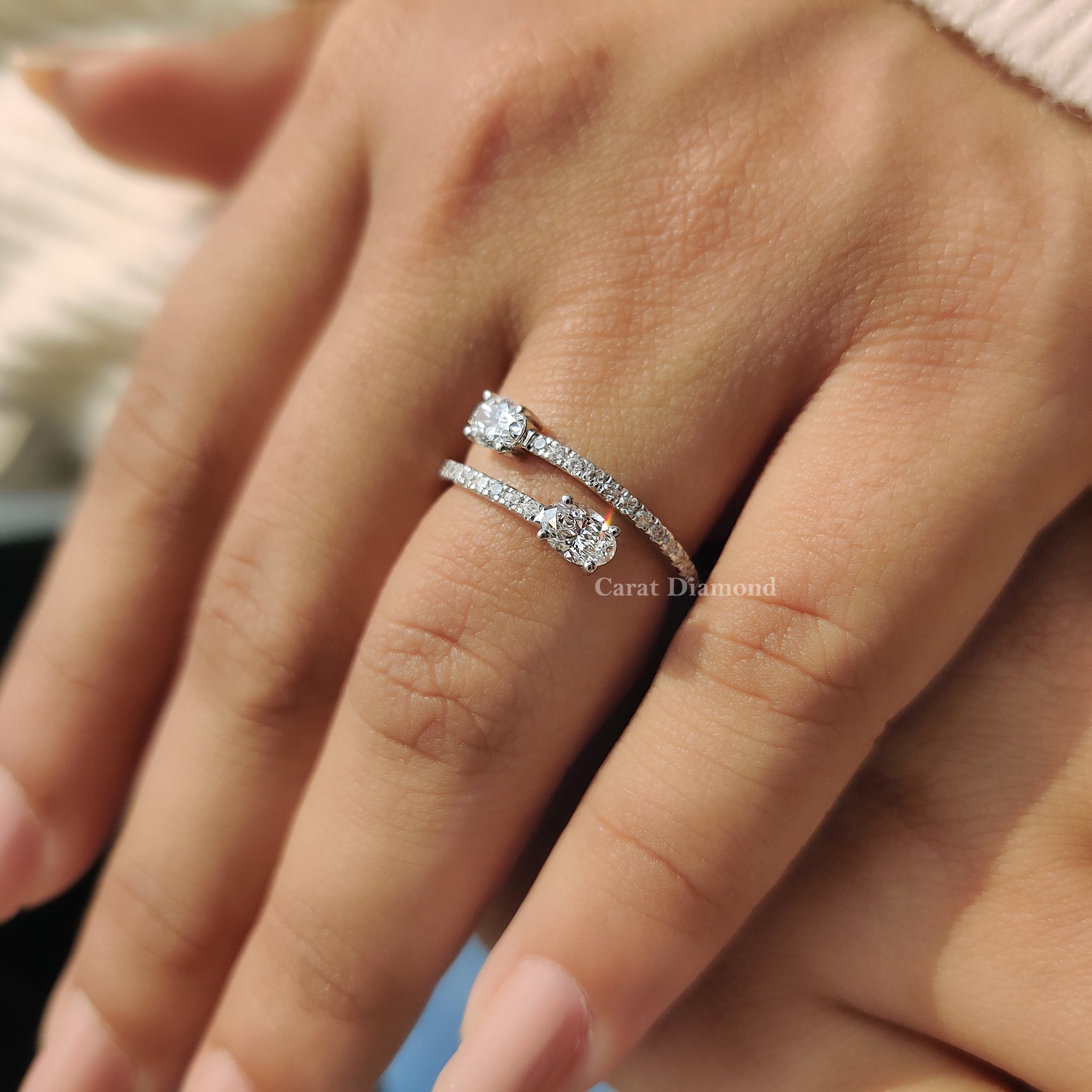 Oval bypass engagement ring offers shape and movement in one piece.
