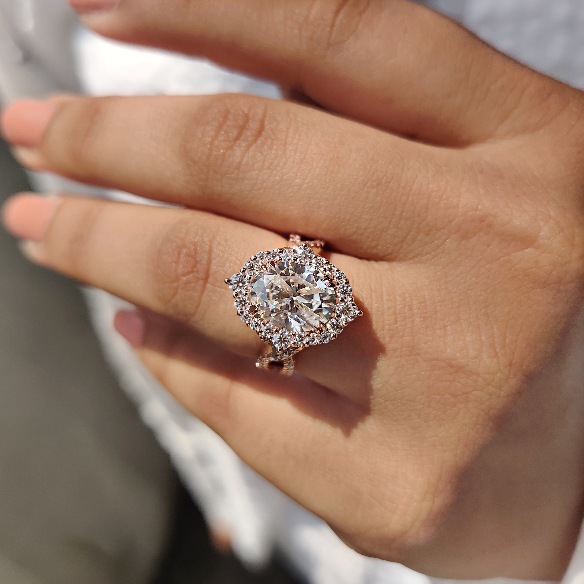 Rose gold engagement ring with warm tones and a strong presence.

