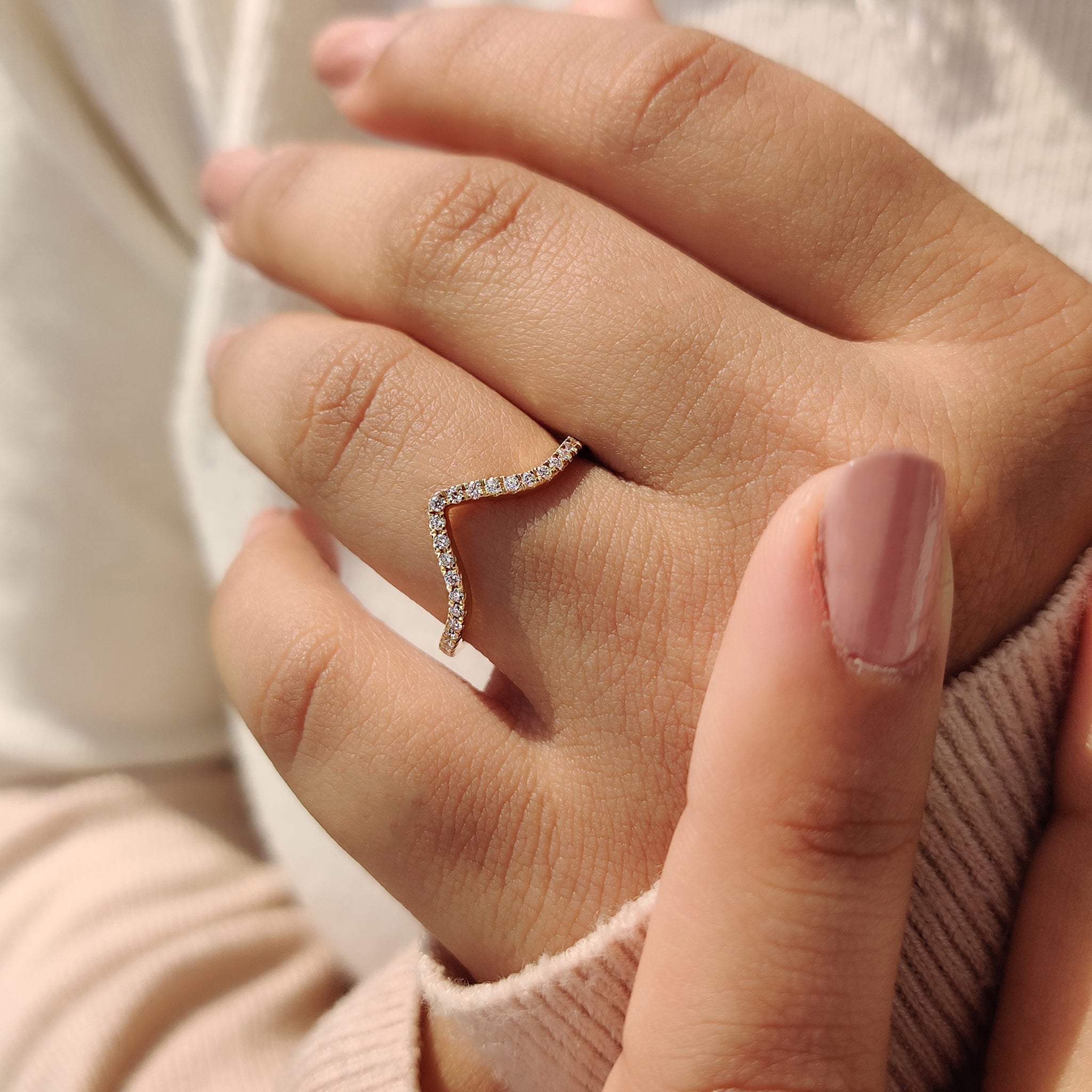 A minimalist chevron band that adds a unique flair to any jewelry collection.
