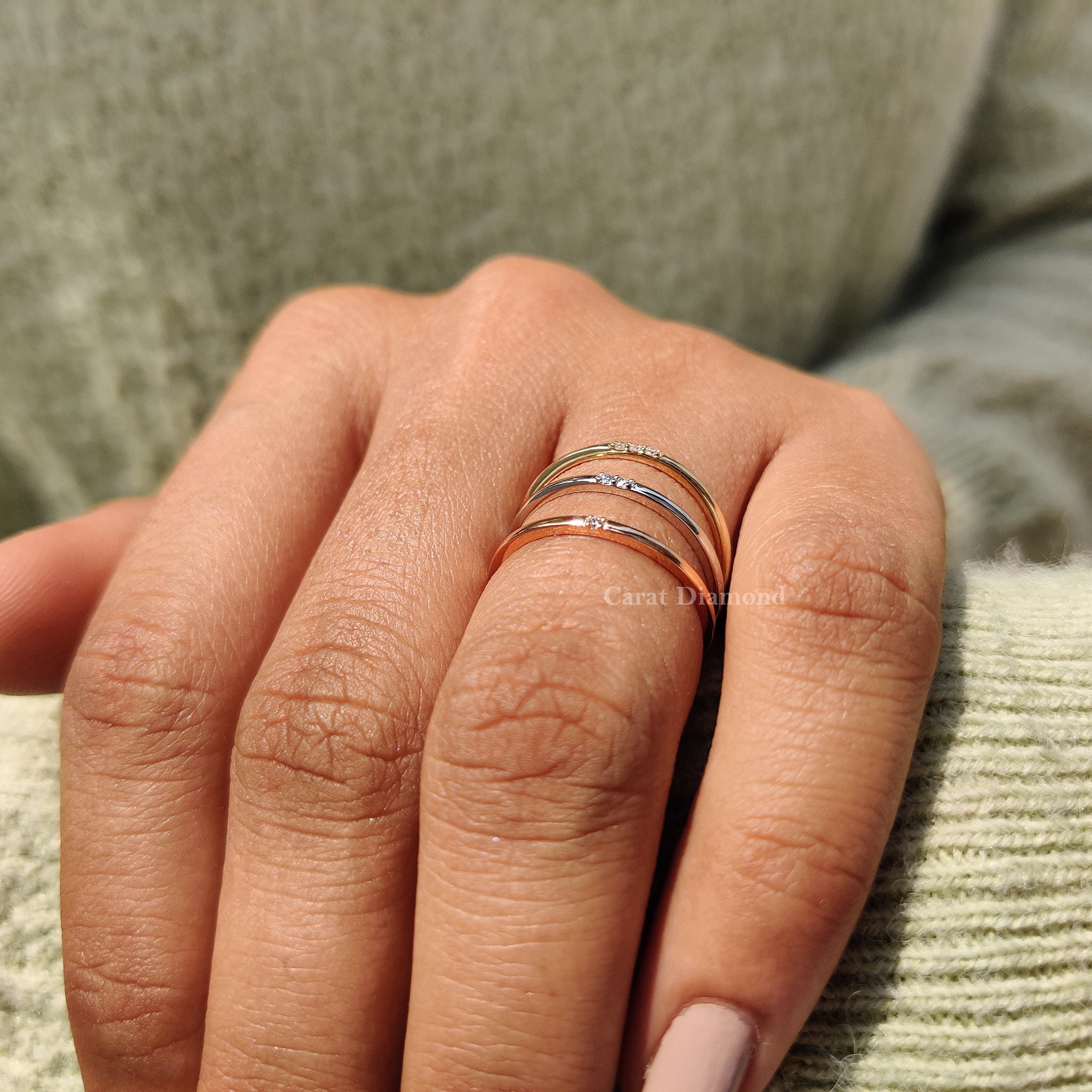 Yellow gold three stone band featuring carat diamonds
