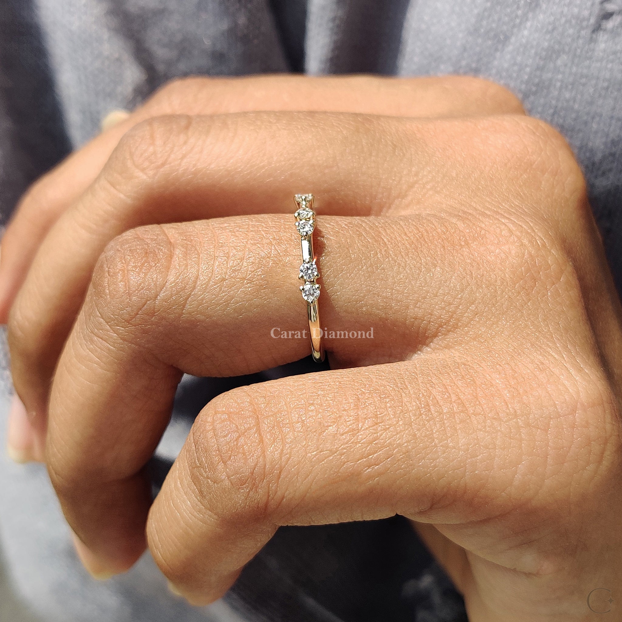 Handmade prong set diamond band featuring lab grown diamonds.
