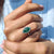 Halo setting ring surrounds stones with radiant light.
