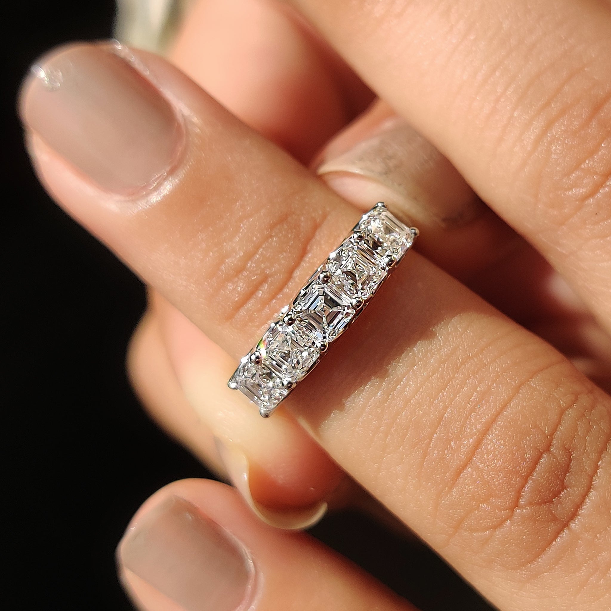 Elegant white gold wedding band with five Asscher cut lab grown diamonds