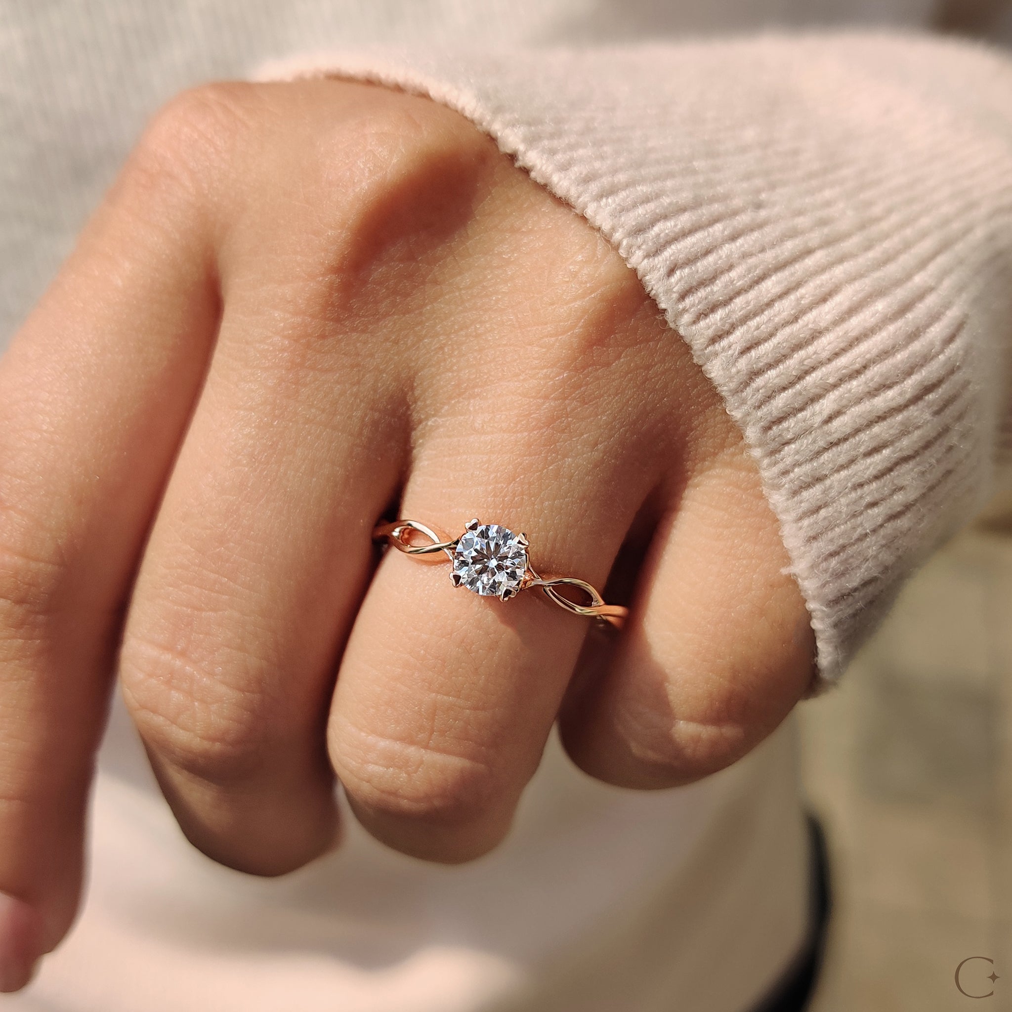 Handmade ring featuring a stunning round solitaire diamond in a twisted shank.
