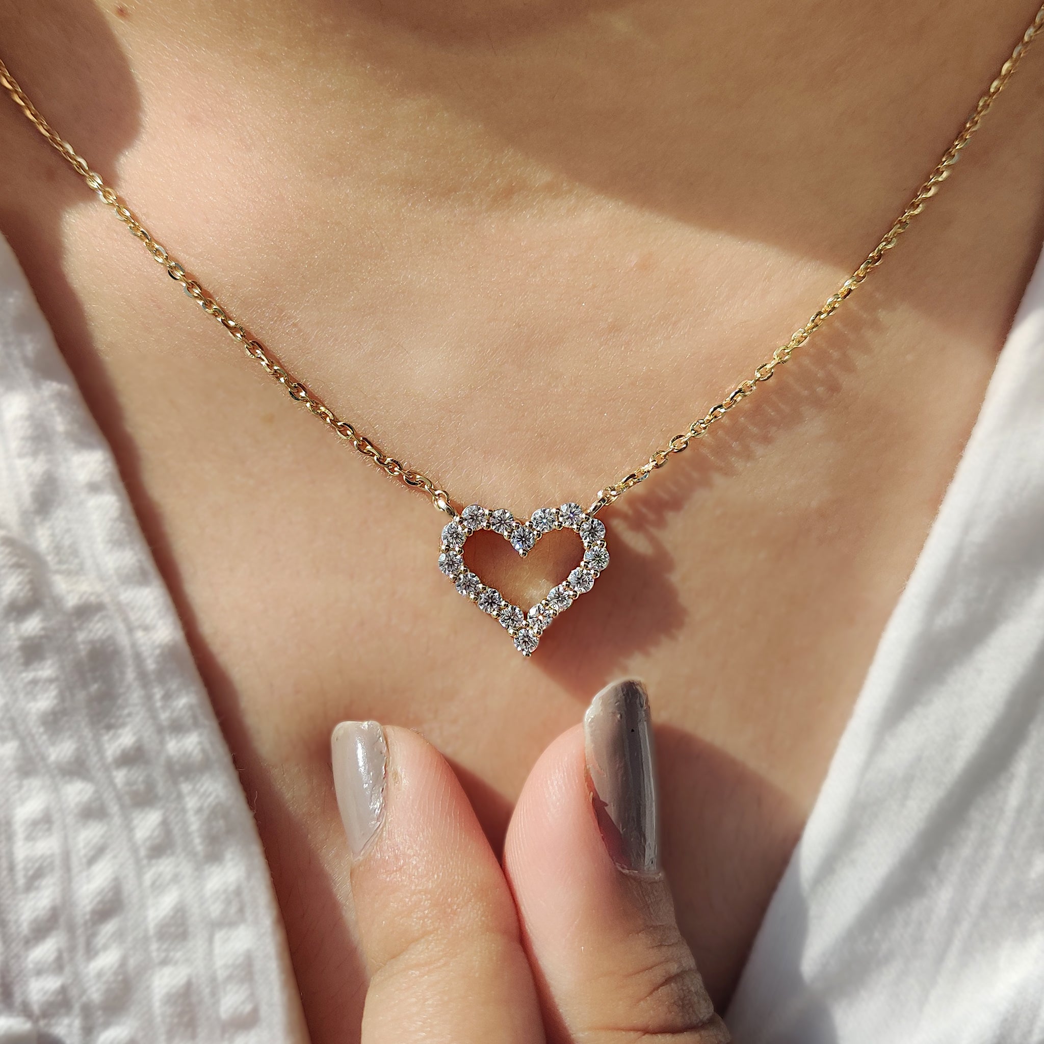 Handmade jewelry pendant with a round diamond.
