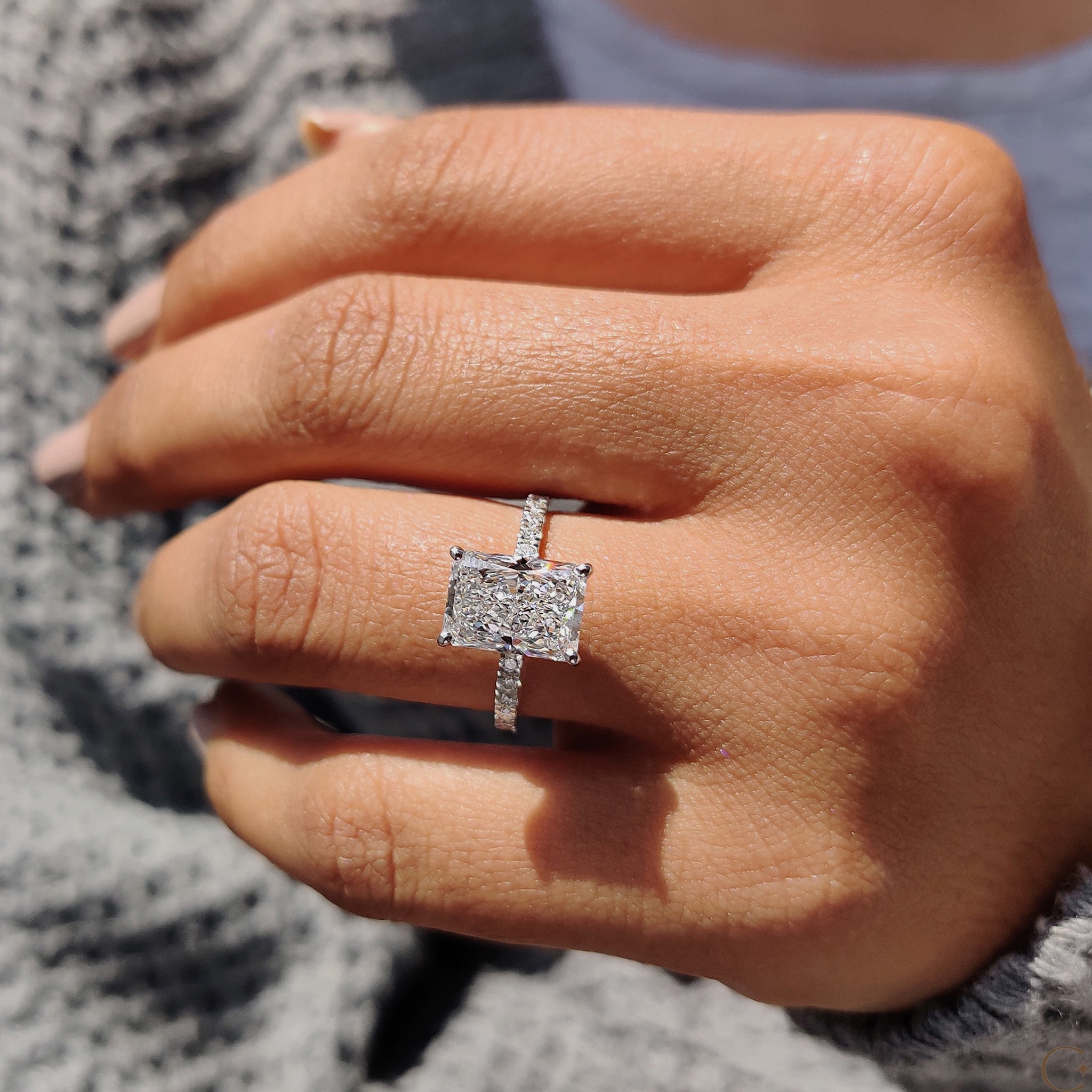 Carat Diamonds engagement ring featuring a round cut pave.
