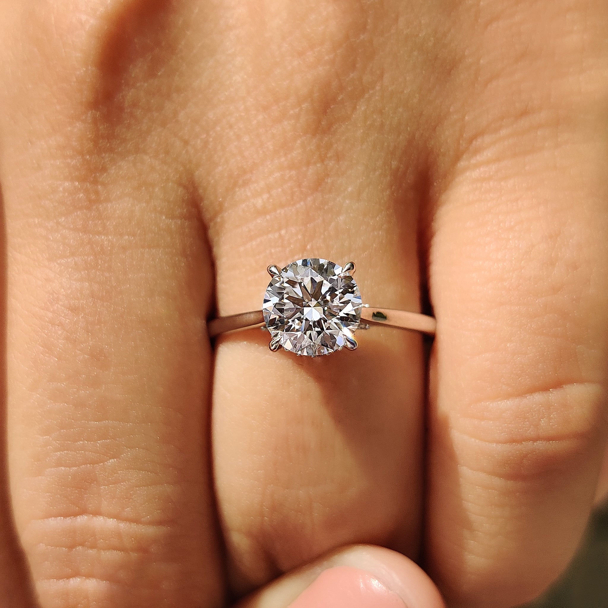 Tapered shank ring with hidden halo engagement ring.
