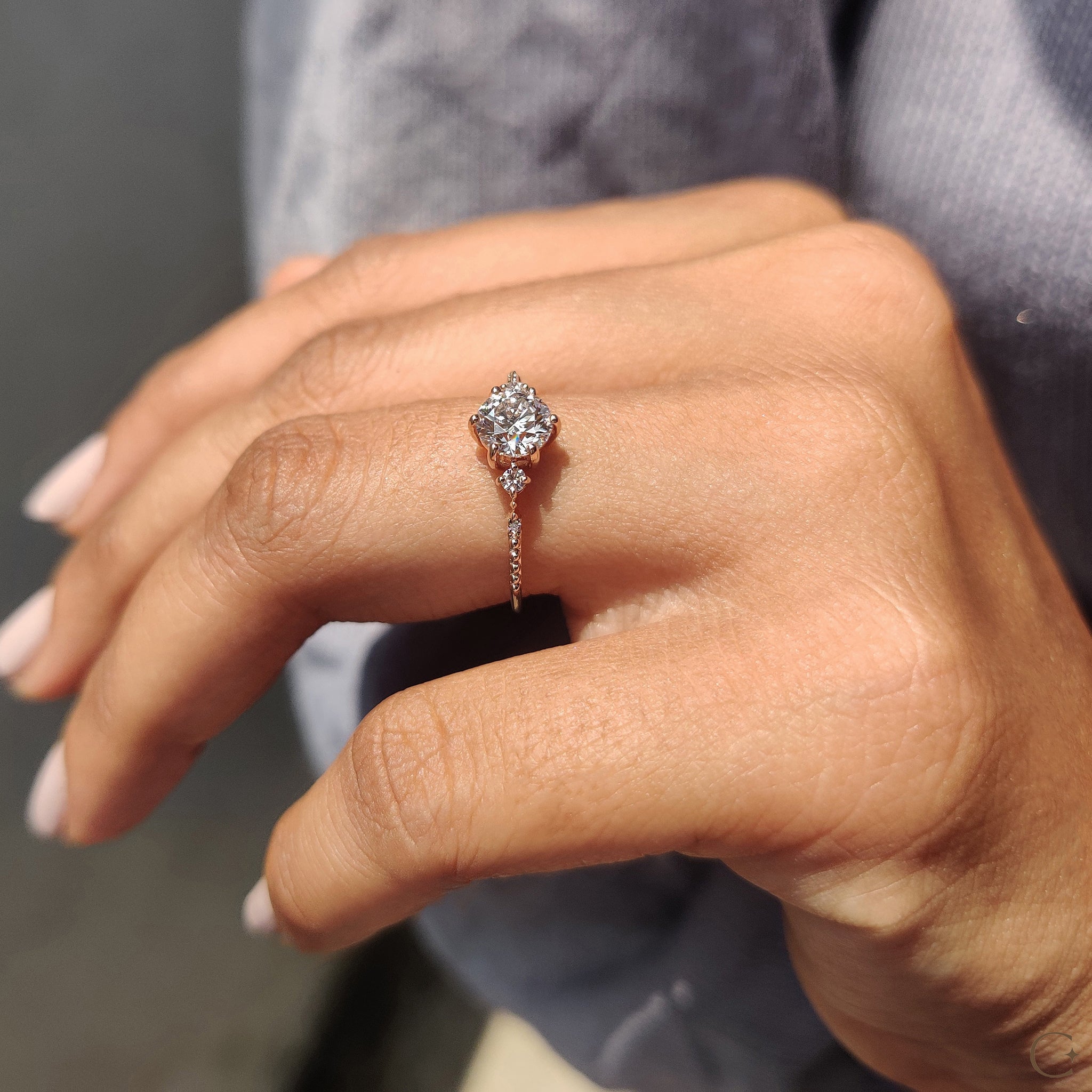 Rose gold diamond ring with a soft, romantic hue.