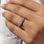 Handmade jewelry wedding band with oval cut moissanite and clean gold finish.