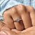 Round cut moissanite engagement ring with brilliant sparkle.