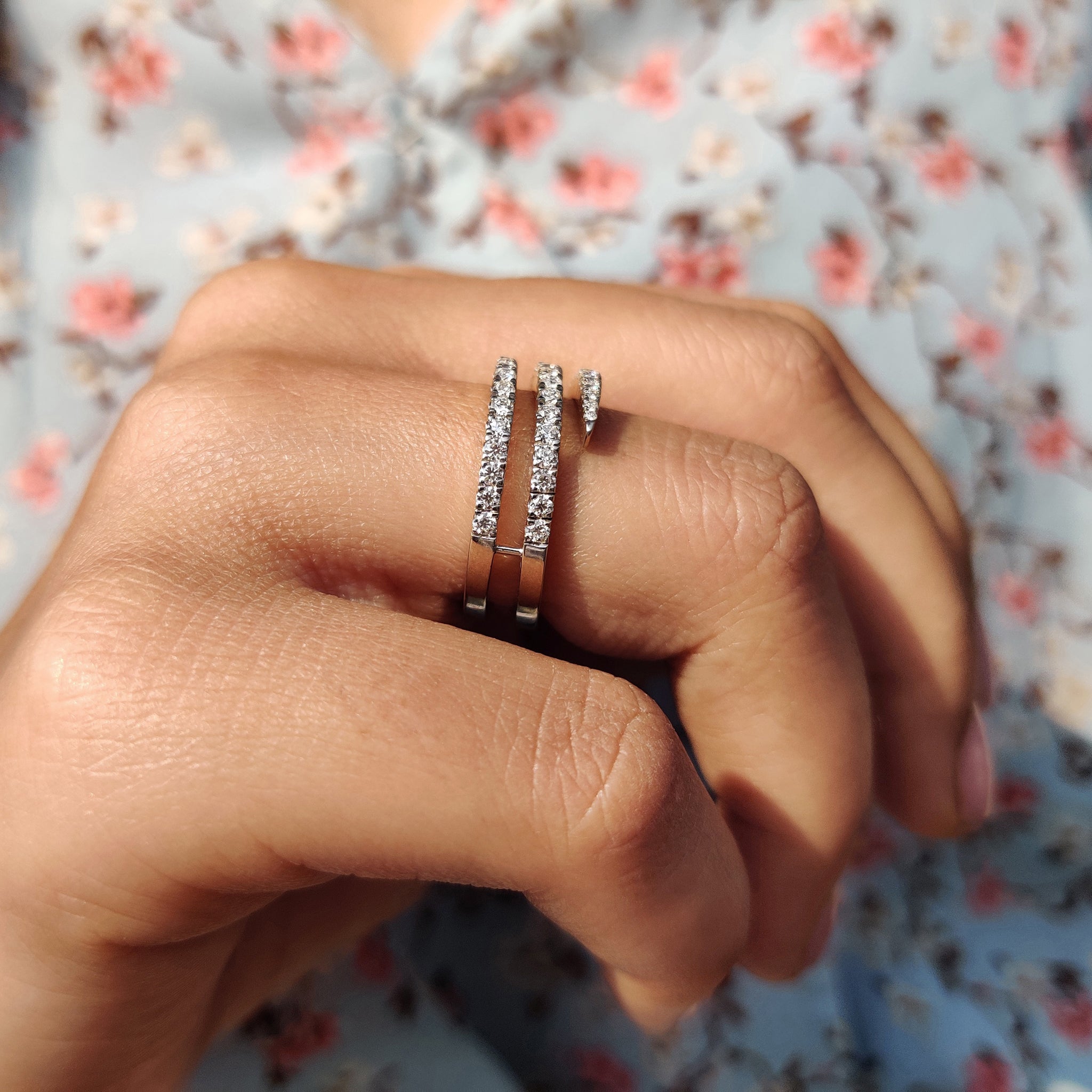 Round Moissanite wedding band with a simple yet elegant design in white gold.