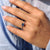 Royal dark blue princess ring with 4 claw prong.
