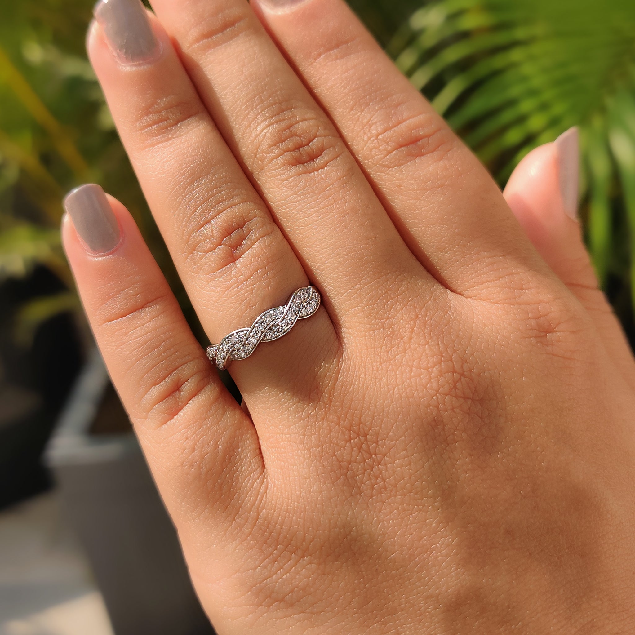 Lab grown diamond wedding band with twisted style.
