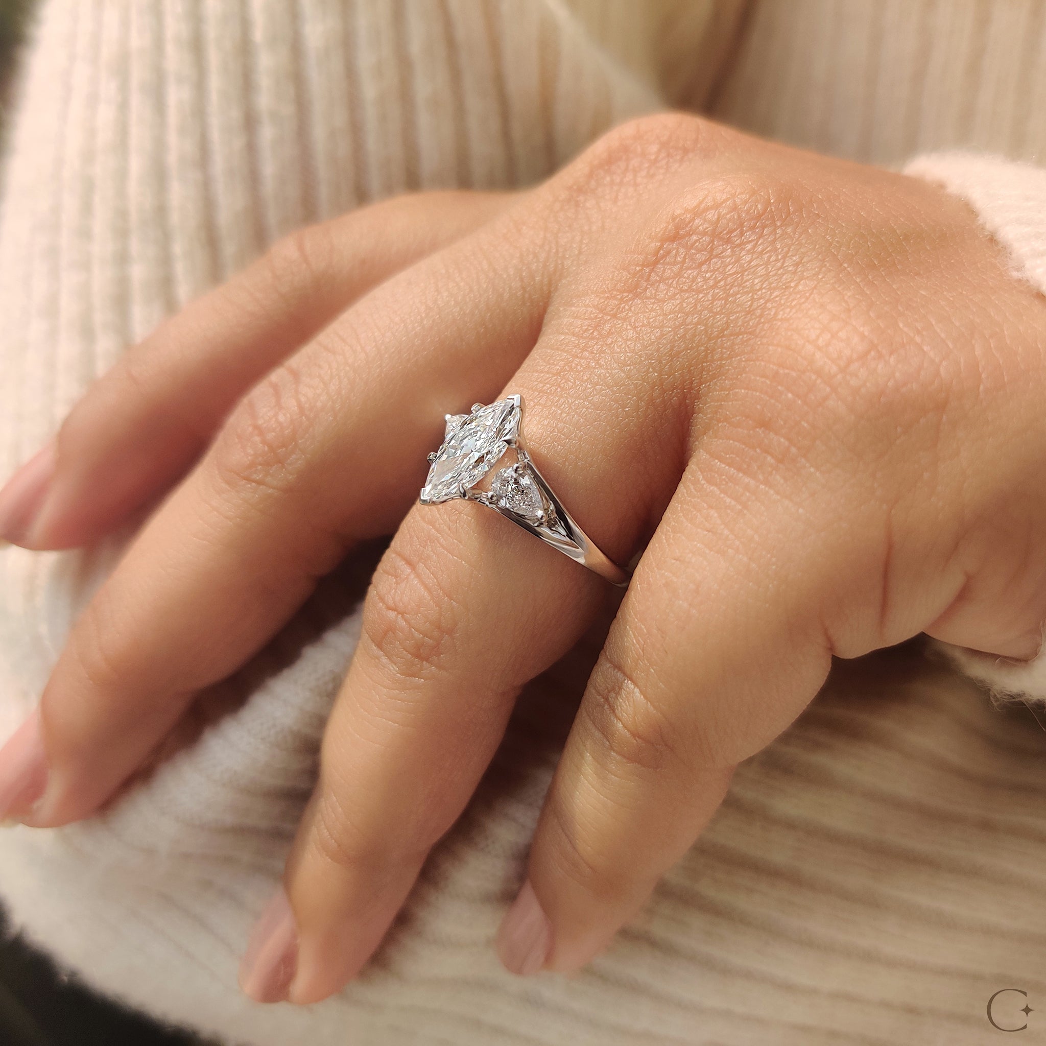 Three diamond engagement ring with a unique split shank.
