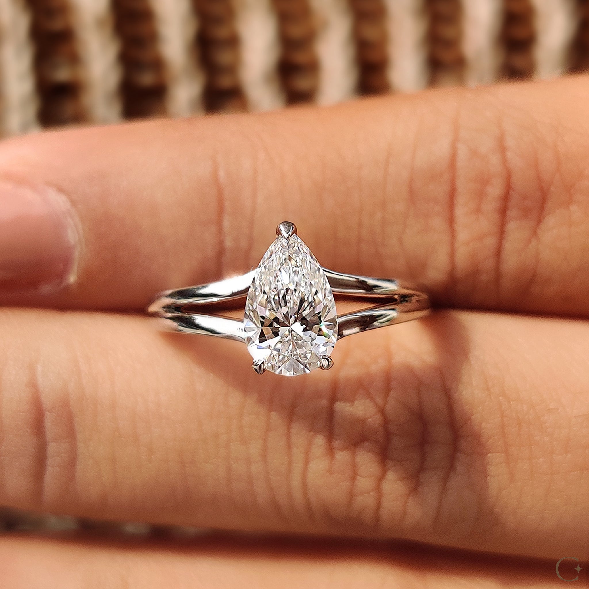 3 prong setting in a pear-shaped diamond ring offering maximum brilliance and security.
