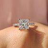 Princess cut engagement ring with sparkling pave setting.
