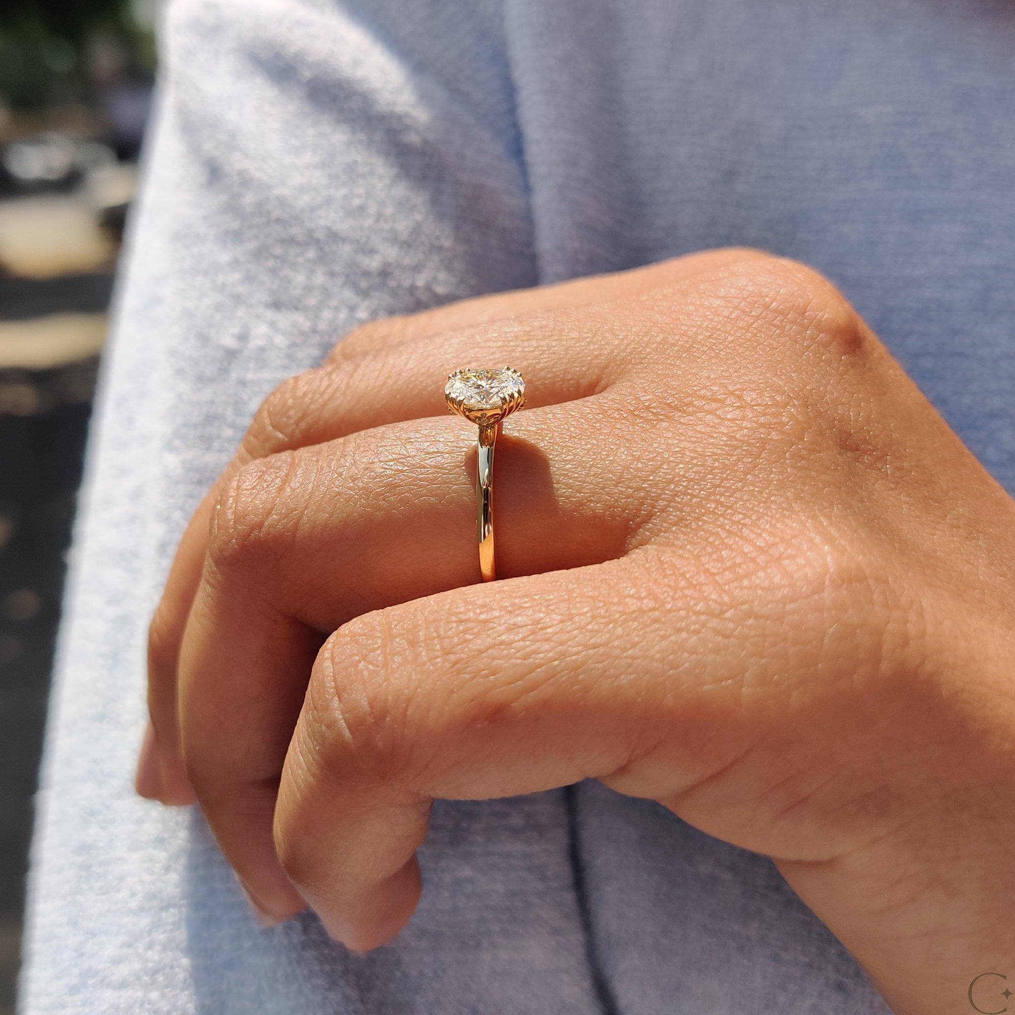 Unique triple prong ring with an oval shaped diamond.
