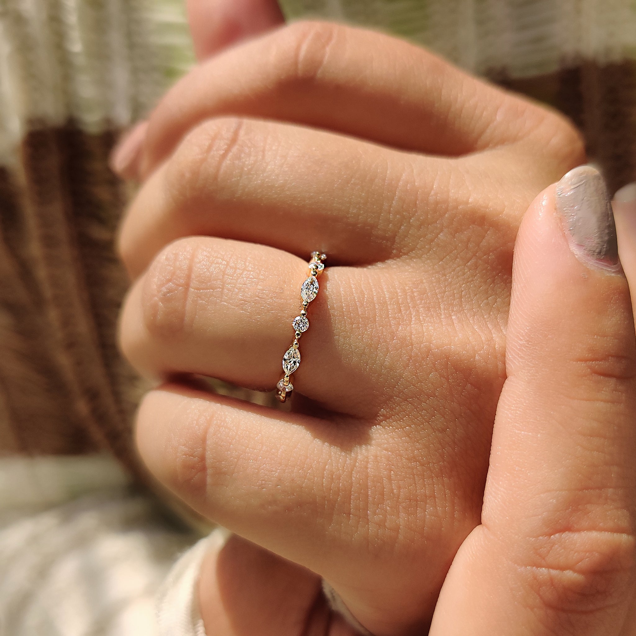 Handmade jewelry with marquise wedding band.