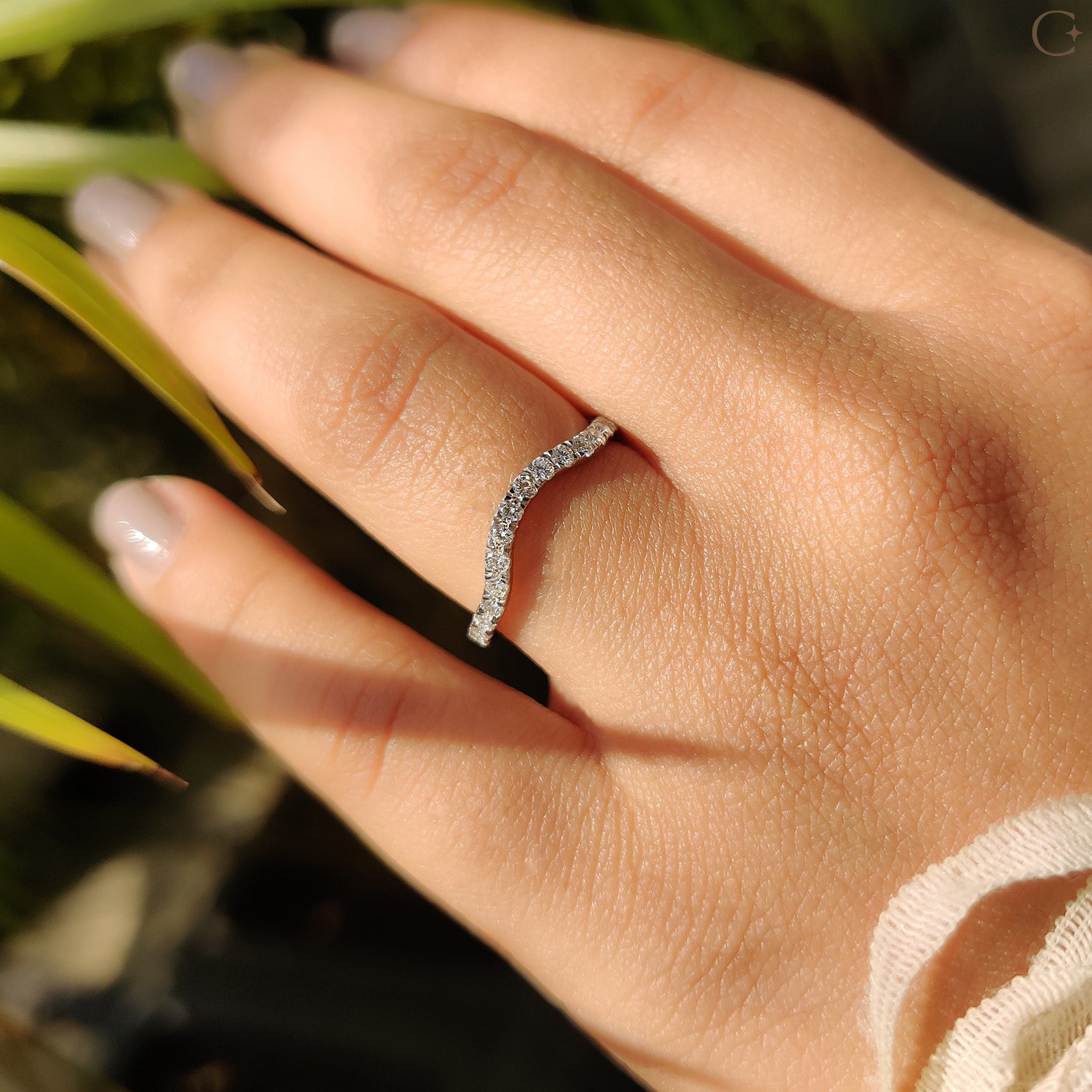Handmade jewelry wedding band with unique charm.