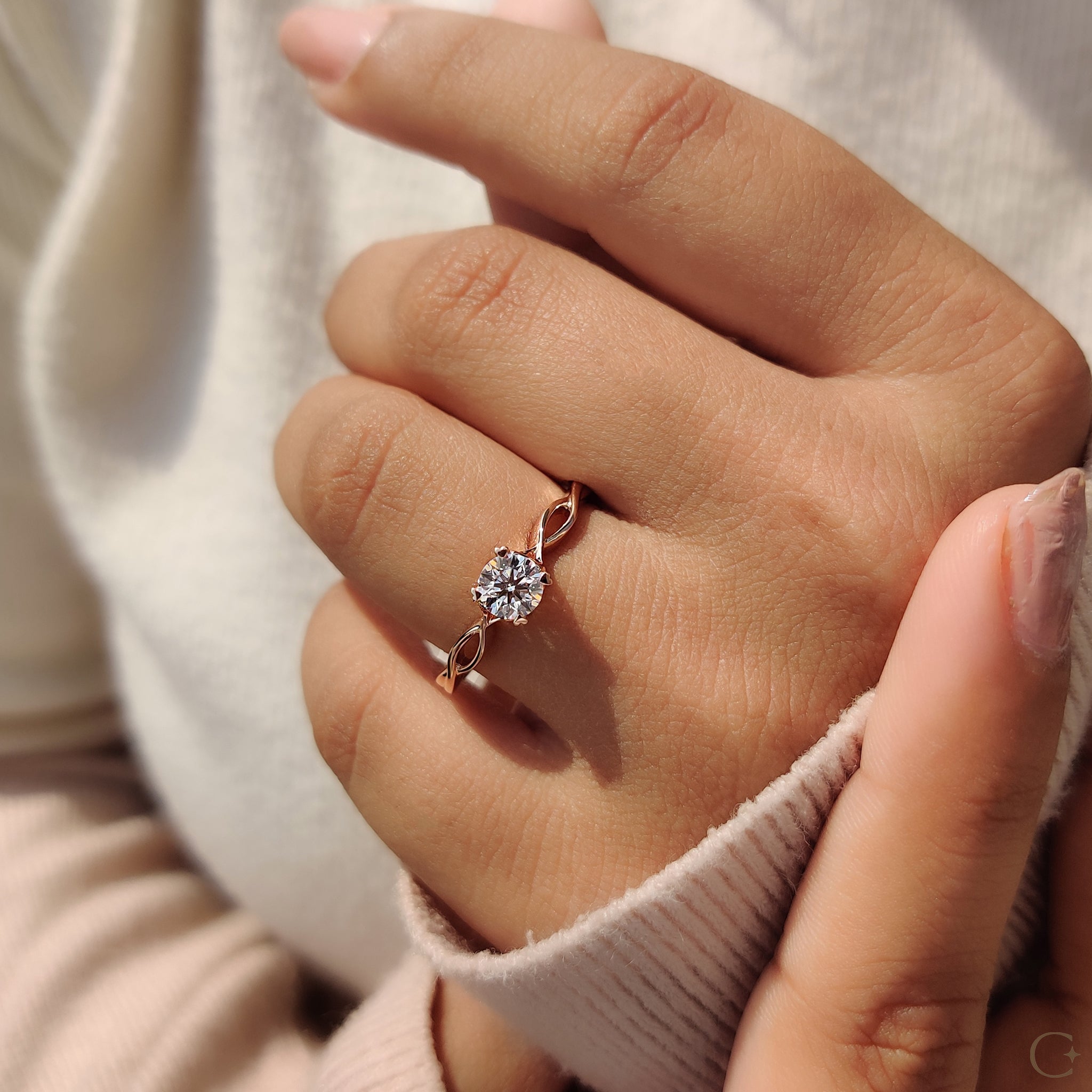 Handmade jewelry featuring a classic round solitaire engagement ring.
