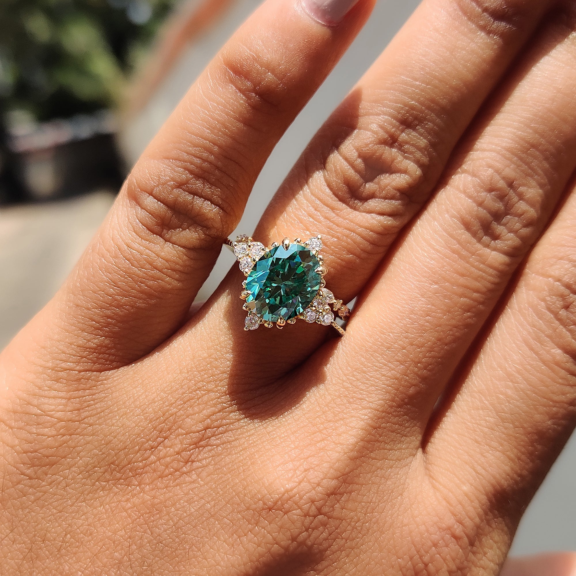 Marquise open gap band paired with an oval green moissanite ring.
