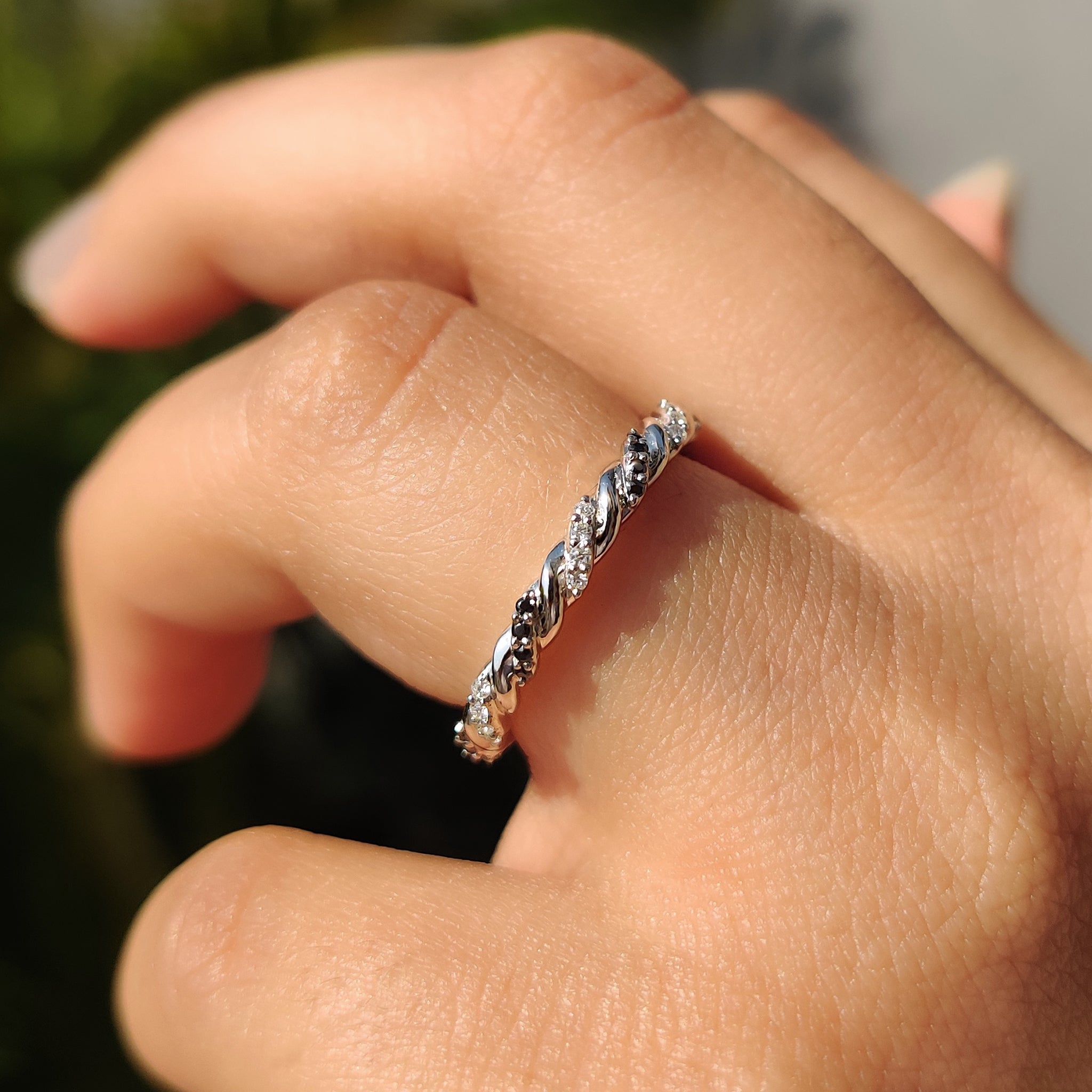Handmade band featuring round cut moissanite.

