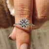 Round cut diamond ring with solitaire engagement ring.