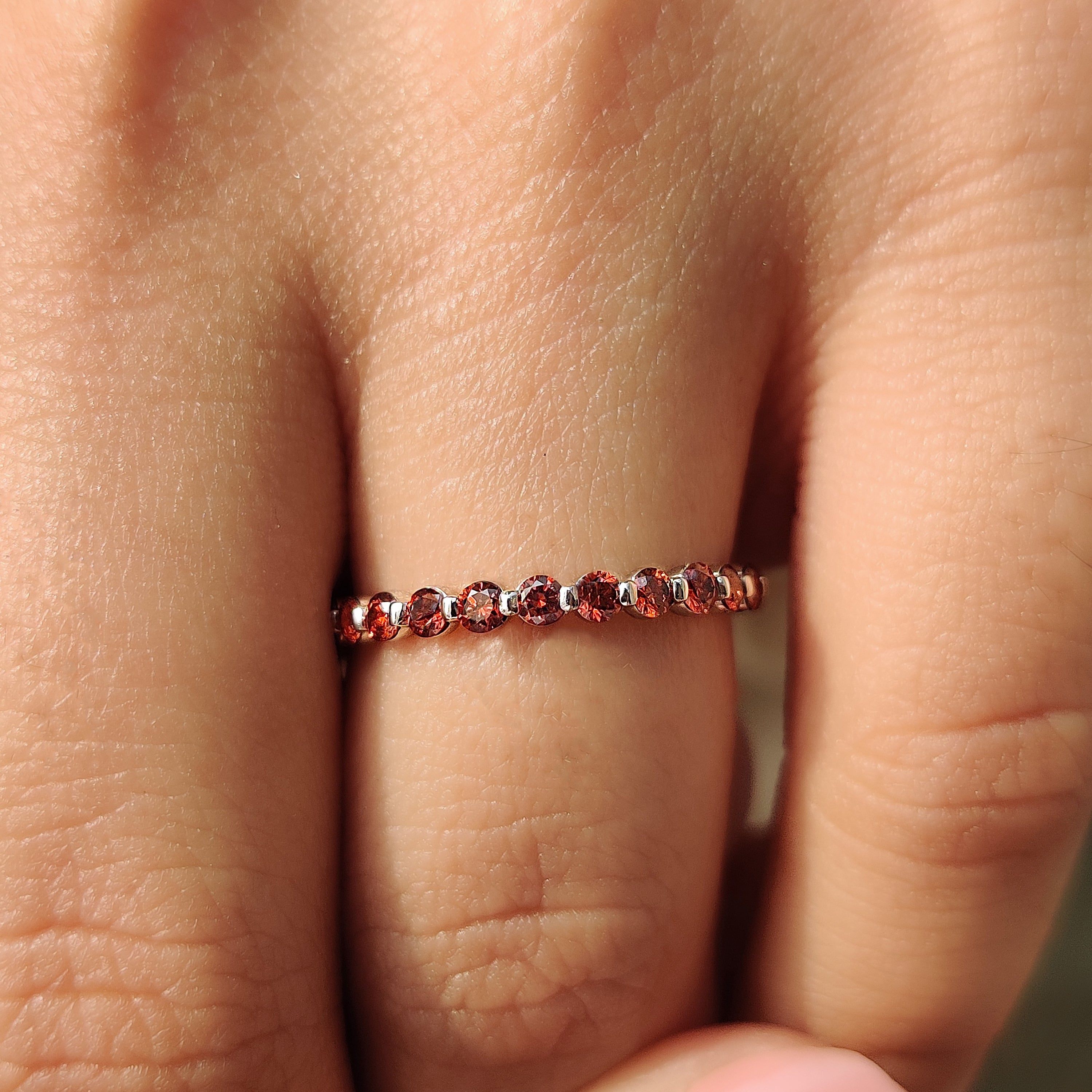 Red diamond wedding band with a bold and unique design
