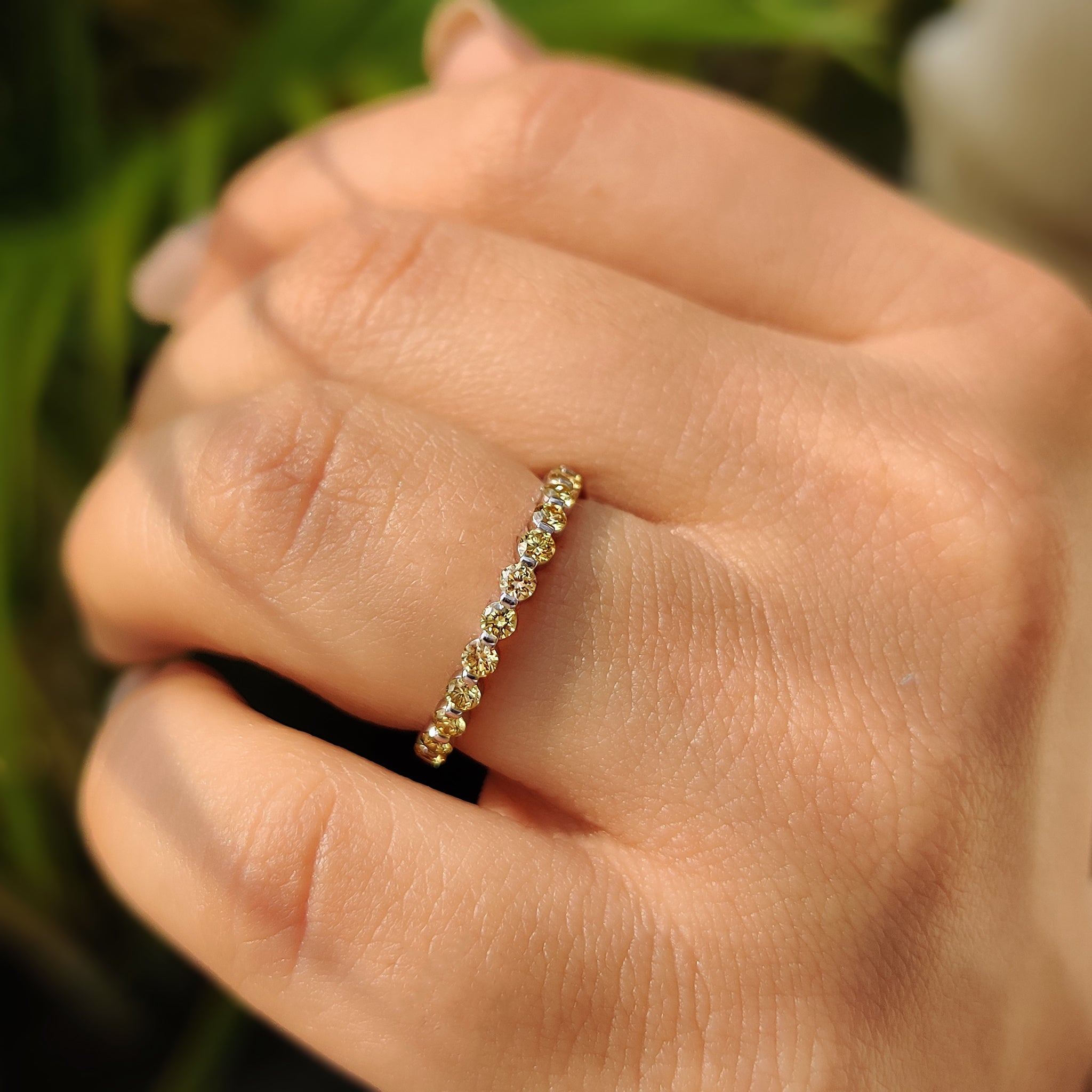Yellow diamond wedding band with a polished finish.
