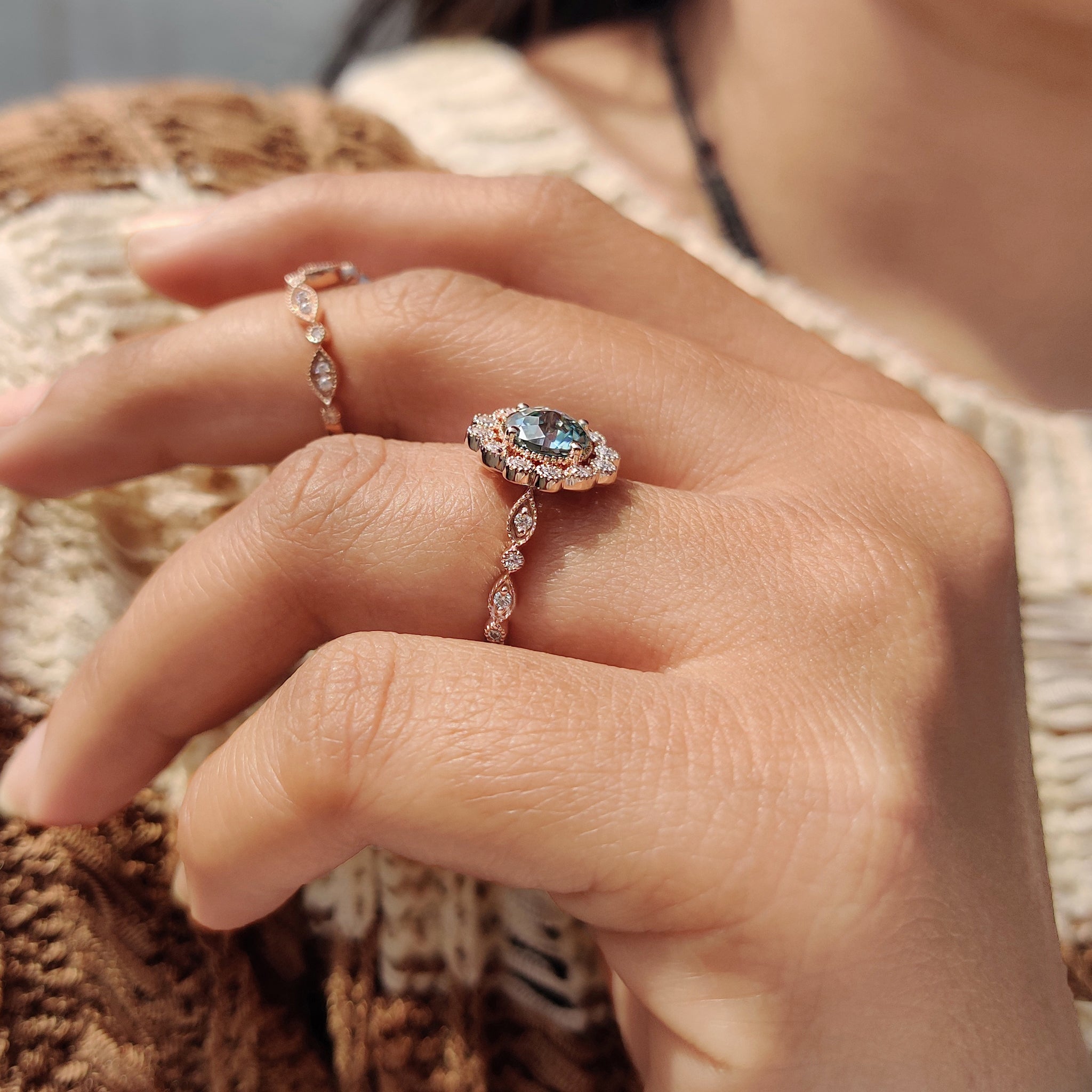 Jubilee cut moissanite ring with halo setting and milgrain detailing.
