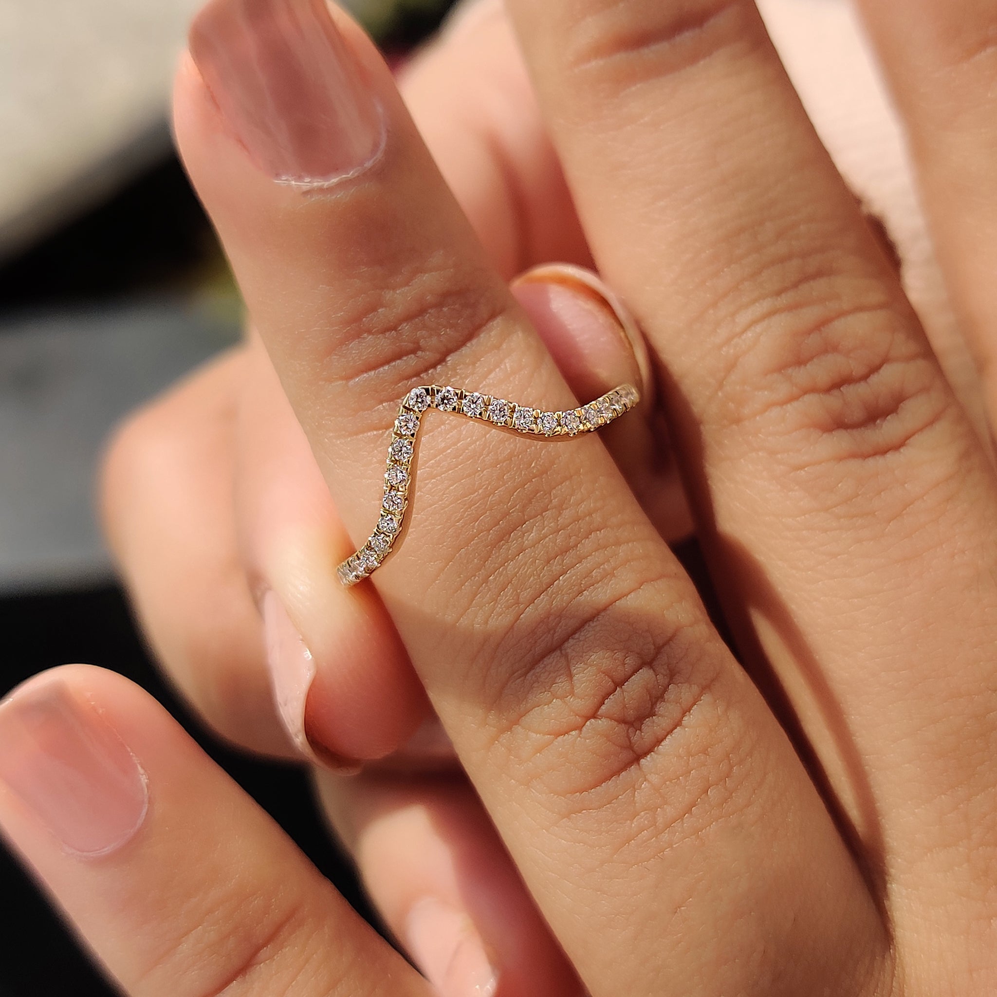 A stylish chevron wedding band featuring a sleek design, perfect for modern brides.
