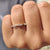 Simple prong set diamond duo band in yellow gold.
