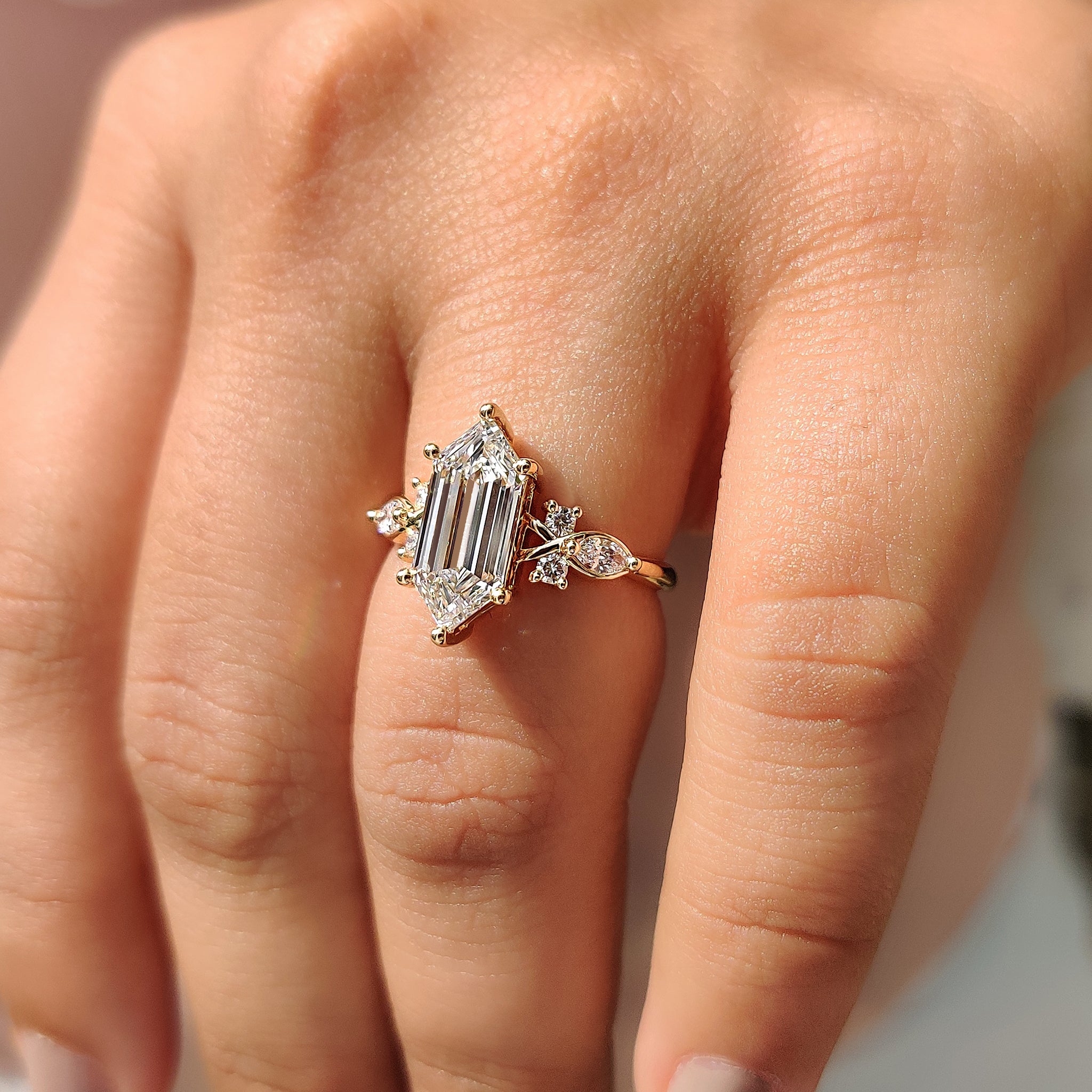 Muse setting ring with cluster engagement ring.