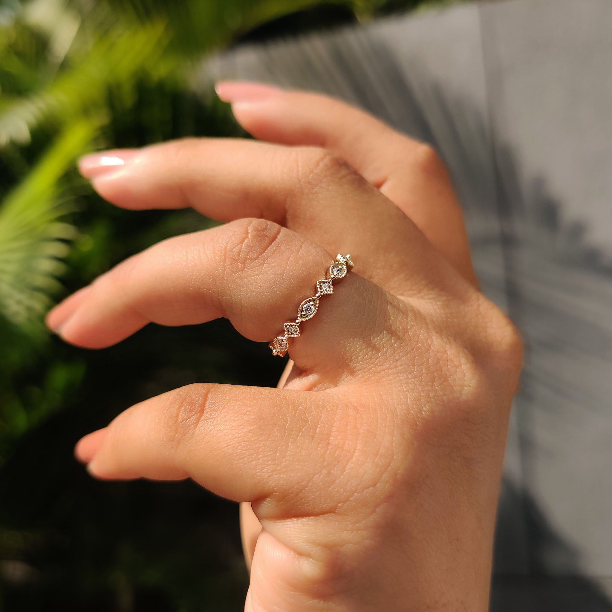 Custom wedding ring with yellow gold, marquise shape, and lab grown diamonds.
