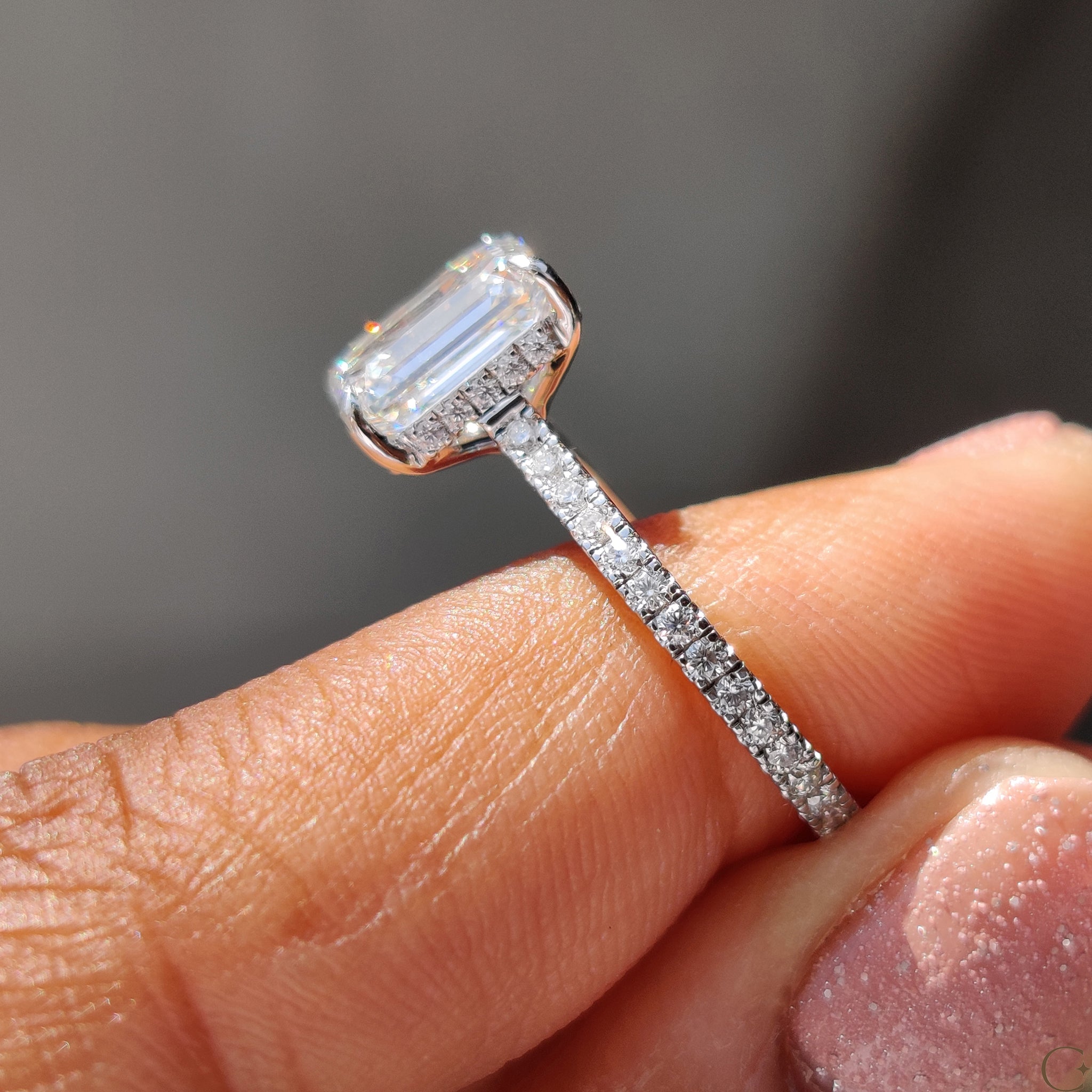 Round cut pave ring with a flawless diamond center.