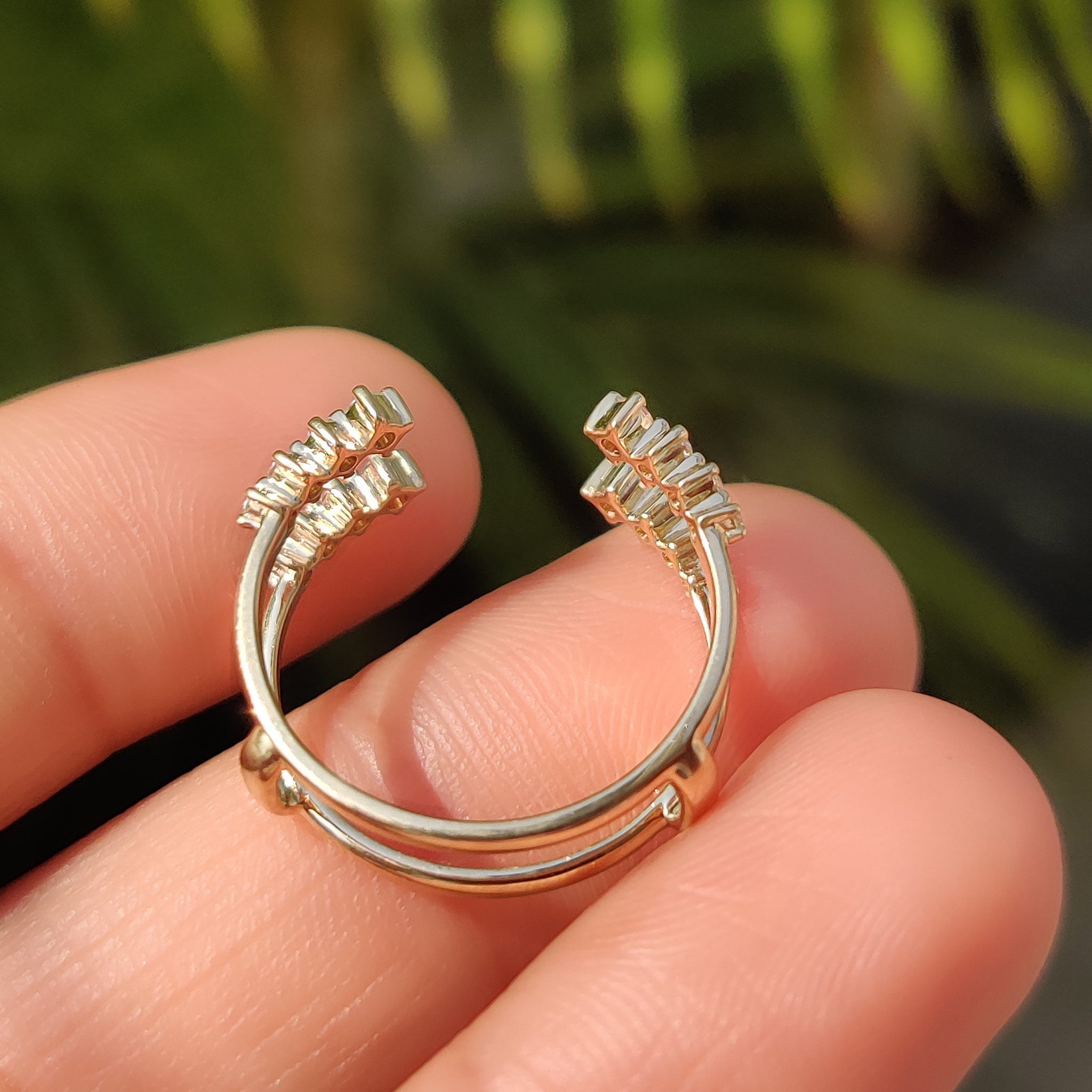 Handmade jewelry featuring a diamond wedding band.
