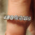 Carat diamonds wedding band with bezel set round cut stones.