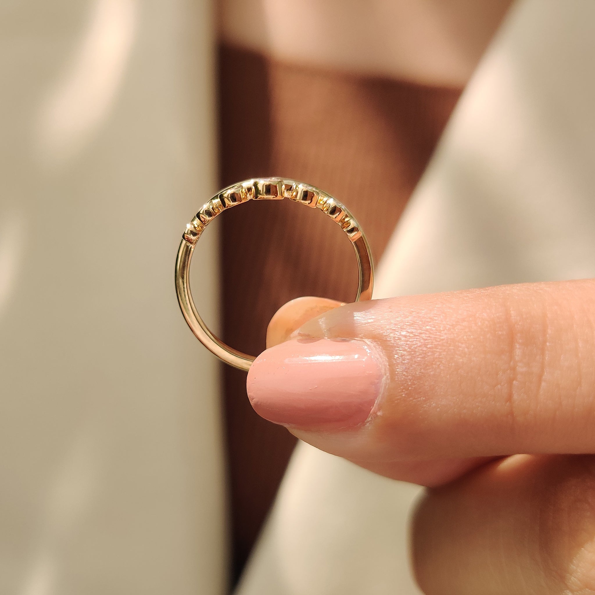 Curved band with round cut diamonds.